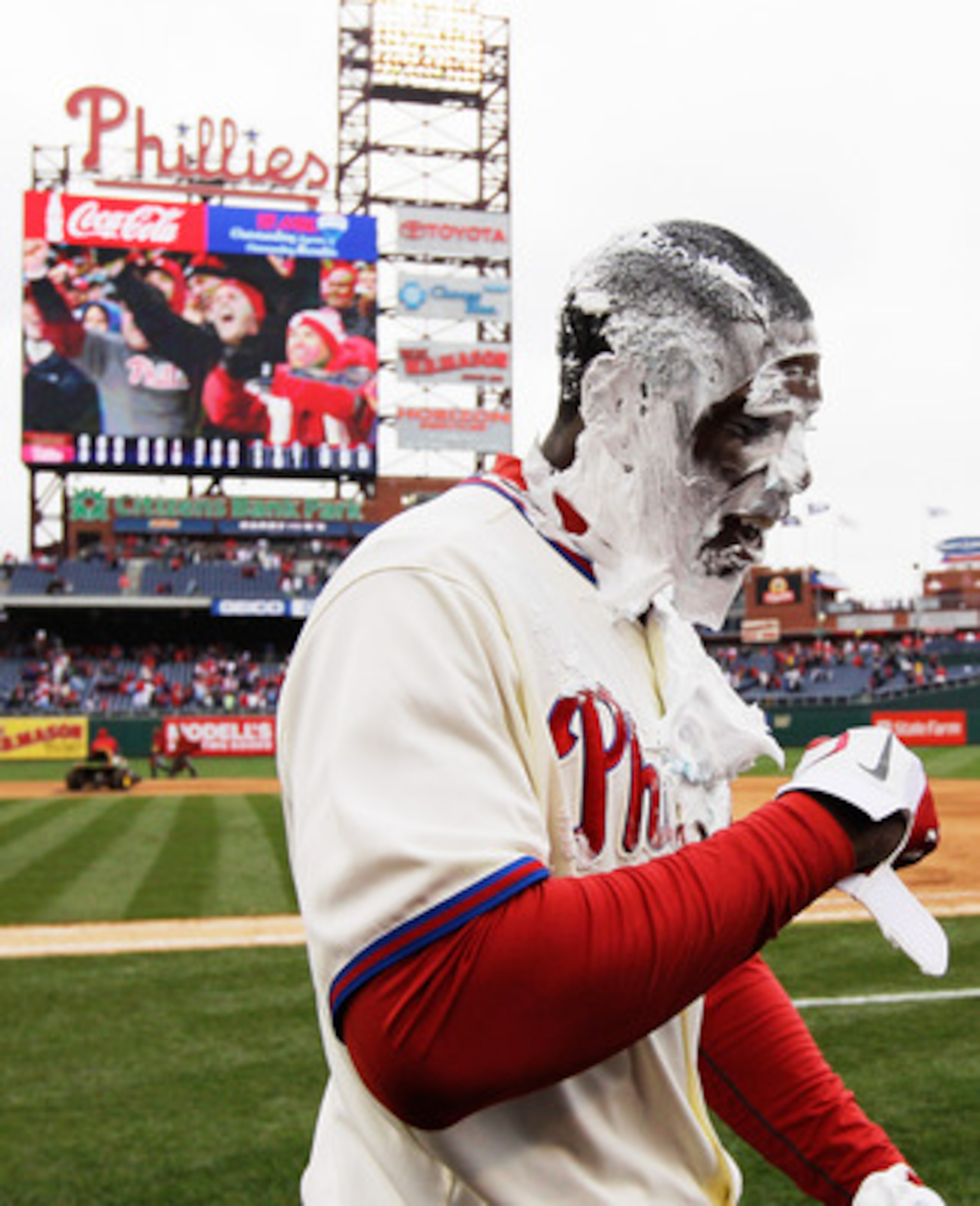 PHILADELPHIA, PA - APRIL 01:  John Mayberry Jr. #15 of the Philadelphia Phillies smiles after getting hit with a cream pie after driving in the game winning run to defeat the Houston Astros 5-4 on opening day at Citizens Bank Park on April 1, 2011 in Phil