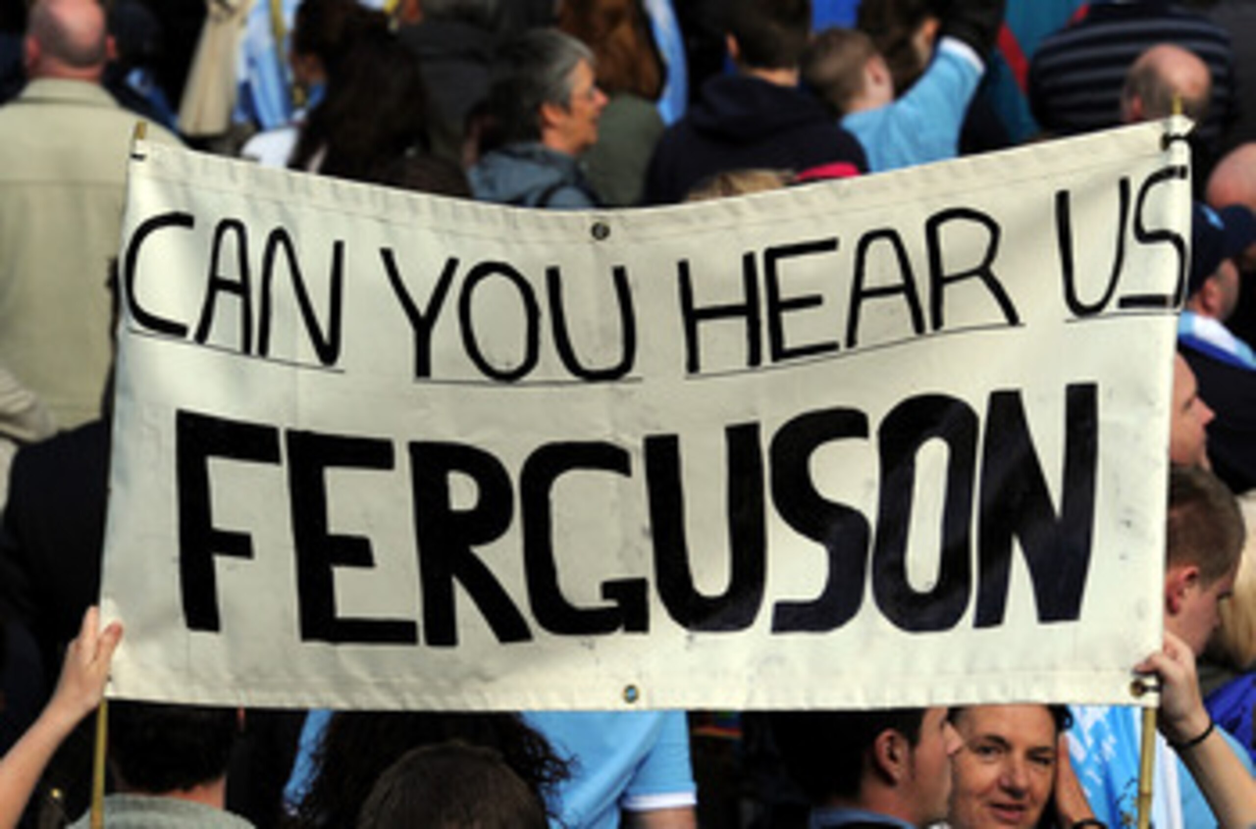 MANCHESTER, ENGLAND - MAY 23: Manchester City fans display a banner during the Manchester City FA Cup Winners Parade at Manchester Town Hall on May 23, 2011 in Manchester, United Kingdom.  (Photo by Chris Brunskill/Getty Images)