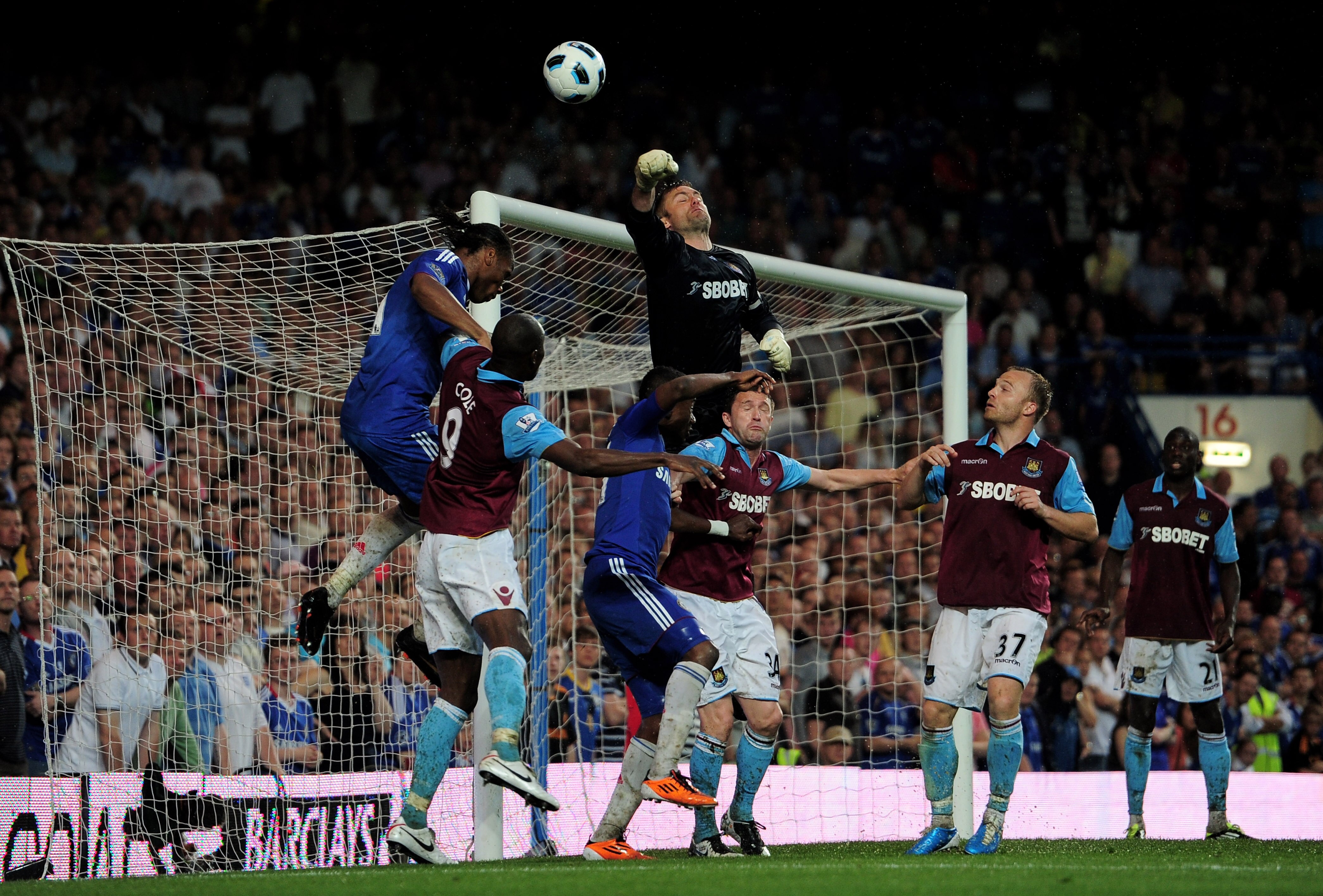 LONDON, ENGLAND - APRIL 23:  Goalkeeper Robert Green of West Ham punches clear a cross during the Barclays Premier League match between Chelsea and West Ham United at Stamford Bridge on April 23, 2011 in London, England.  (Photo by Jamie McDonald/Getty Im