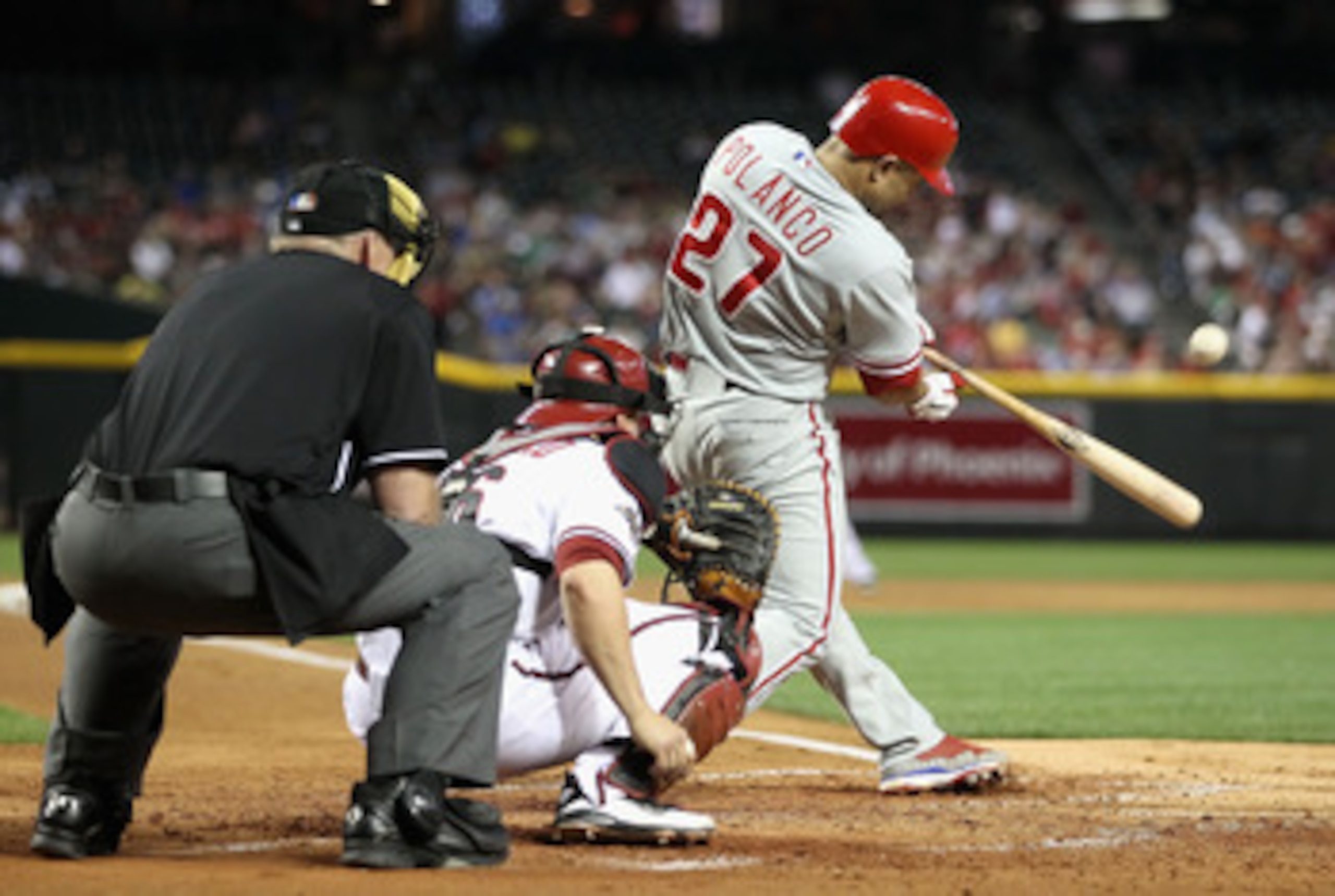 PHOENIX, AZ - APRIL 25:  Placido Polanco #27 of the Philadelphia Phillies hits a single against the Arizona Diamondbacks during the Major League Baseball game at Chase Field on April 25, 2011 in Phoenix, Arizona.  The Diamondbacks defeated the Phillies 4-