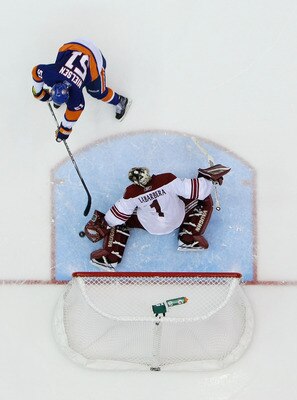 UNIONDALE, NY - DECEMBER 18:  Frans Nielsen #51 of the New York Islanders scores a shootout goal against Jason LaBarbara #1 of the Phoenix Coyotes during their game on December 18, 2010 at the Nassau Coliseum in Uniondale, New York.  (Photo by Al Bello/Ge