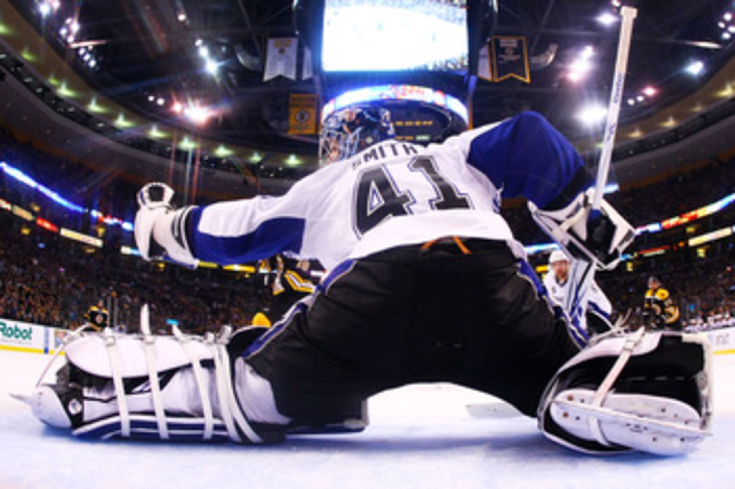 BOSTON, MA - MAY 23:  Mike Smith #41 of the Tampa Bay Lightning reaches for a first period glove save in Game Five of the Eastern Conference Finals against the Boston Bruins during the 2011 NHL Stanley Cup Playoffs at TD Garden on May 23, 2011 in Boston,