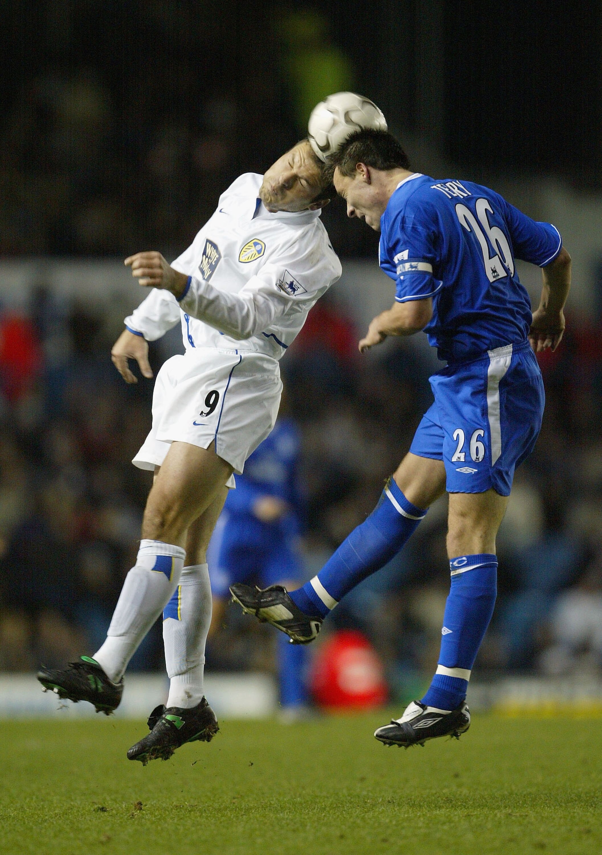 LEEDS, ENGLAND - DECEMBER 6:  Mark Viduka of Leeds and John Terry of Chelsea both jump for the ball during the FA Barclaycard Premiership match between Leeds United and Chelsea at Elland Road on December 6, 2003 in Leeds, England.  (Photo by Laurence Grif