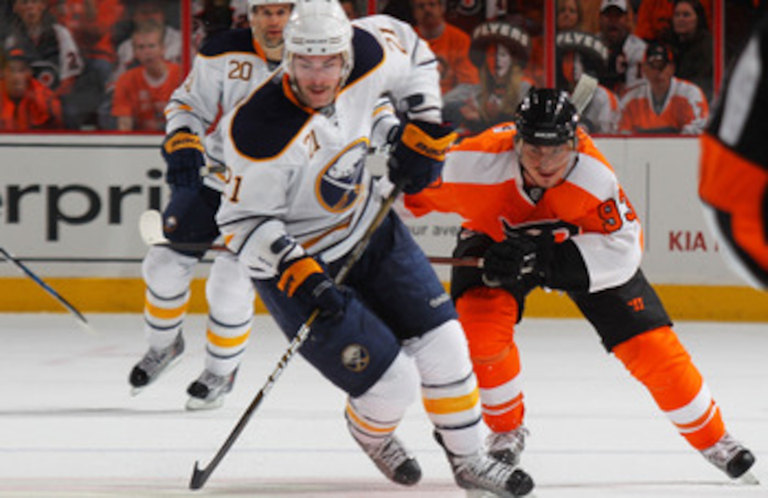 PHILADELPHIA, PA - APRIL 22:  Drew Stafford #21 of the Buffalo Sabres controls the puck against Nikolay Zherdev #93 of the Philadelphia Flyers in Game Five of the Eastern Conference Quarterfinals during the 2011 NHL Stanley Cup Playoffs at Wells Fargo Cen