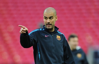 LONDON, ENGLAND - MAY 27:  Josep Guardiola manager of FC Barcelona gives instructions during a Barcelona training session prior to the UEFA Champions League final versus Manchester United at Wembley Stadium on May 27, 2011 in London, England.  (Photo by J