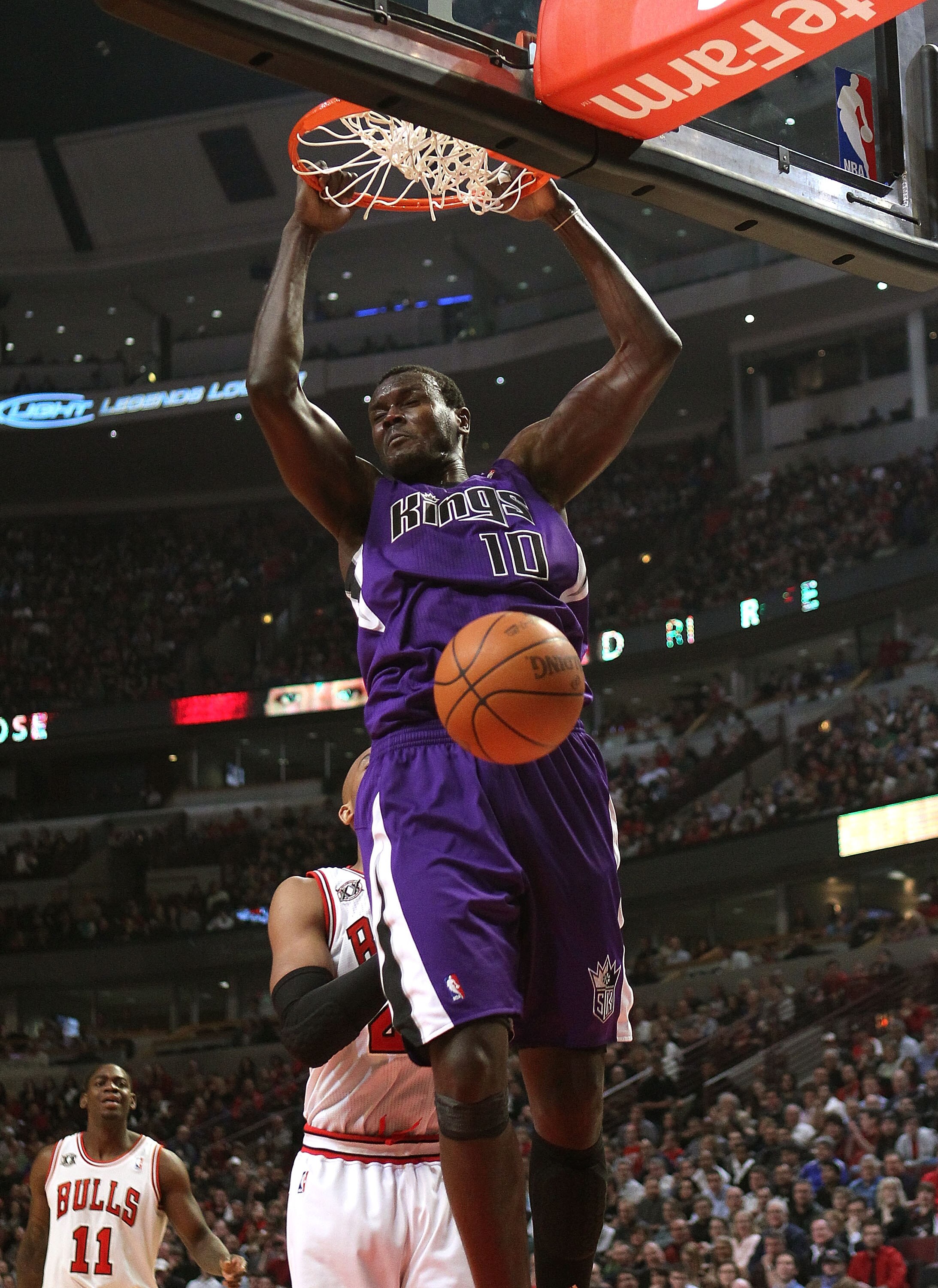 CHICAGO, IL - MARCH 21: Samuel Dalembert #10 of the Sacramento Kings dunks the ball against the Chicago Bulls at the United Center on March 21, 2011 in Chicago, Illinois. NOTE TO USER: User expressly acknowledges and agrees that, by downloading and/or usi