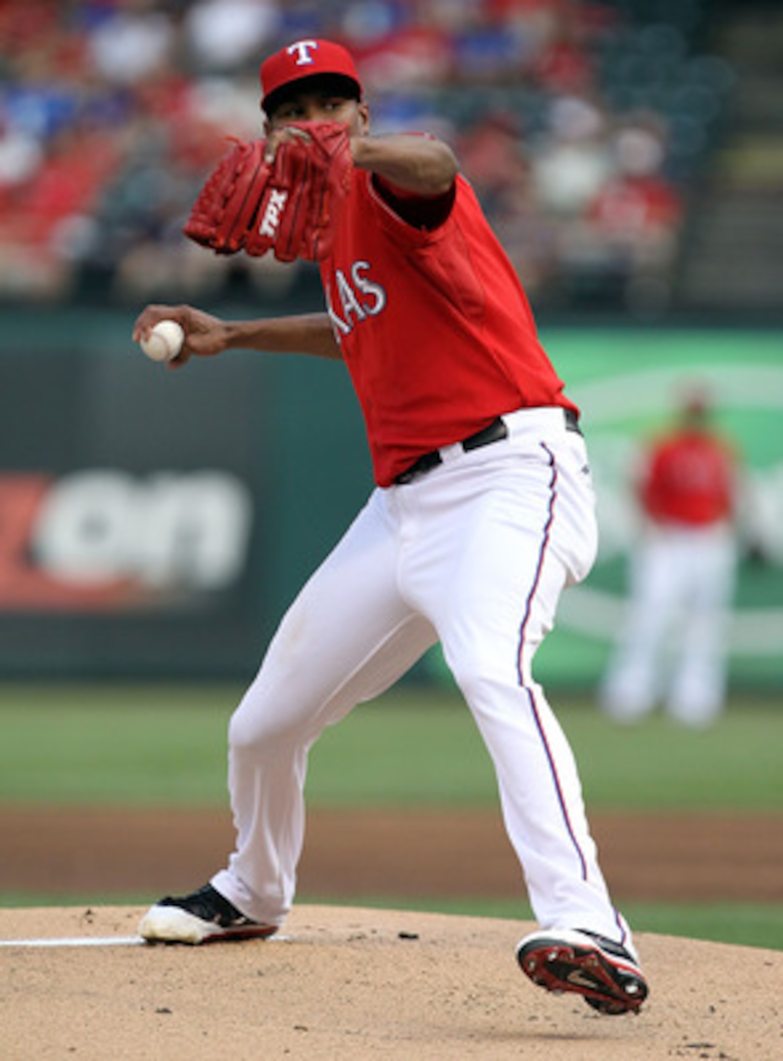 ARLINGTON, TX - JUNE 08:  Pitcher Alexi Ogando #41 of the Texas Rangers throws against the Detroit Tigers at Rangers Ballpark in Arlington on June 8, 2011 in Arlington, Texas.  (Photo by Ronald Martinez/Getty Images)