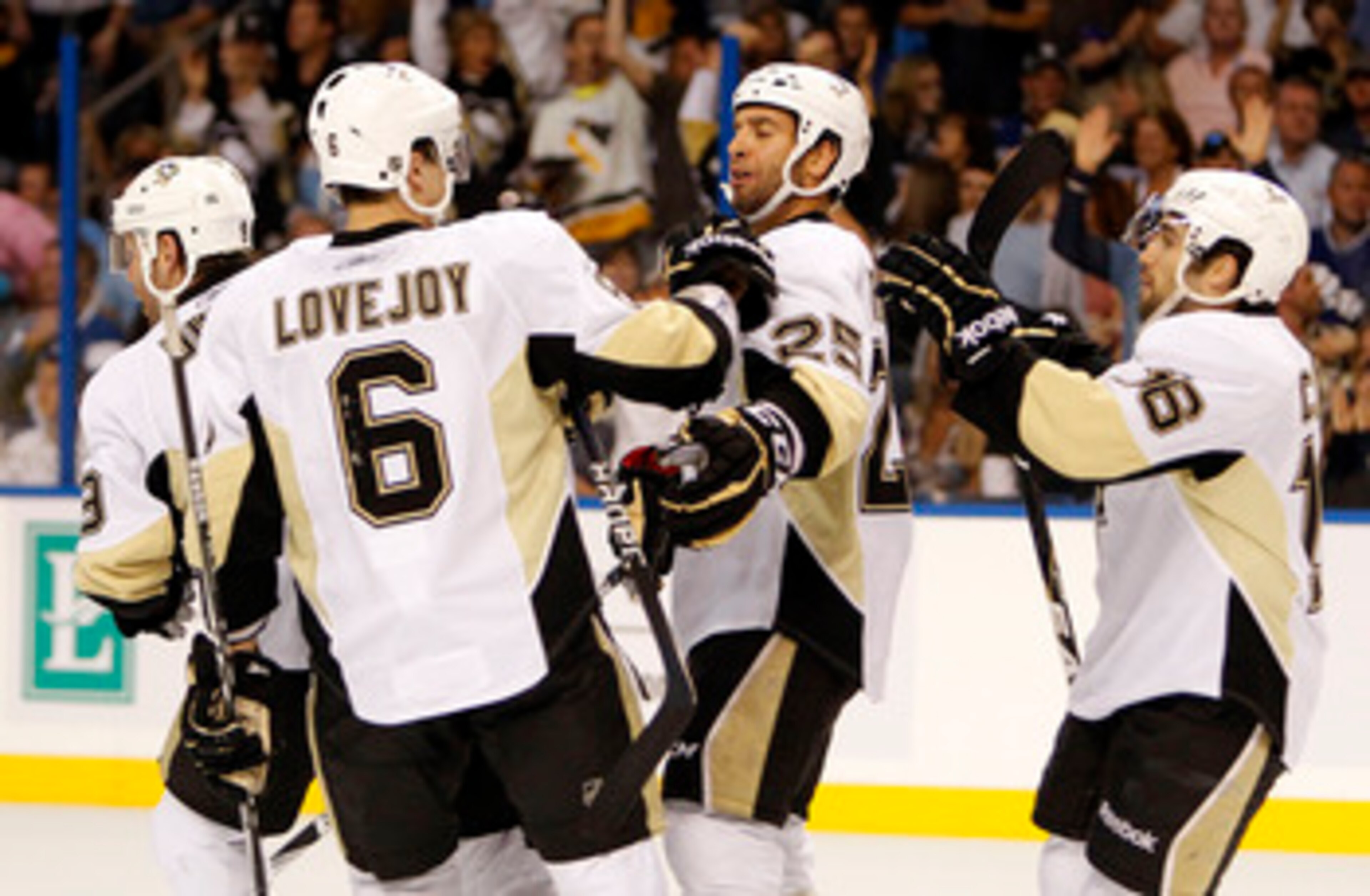 TAMPA, FL - APRIL 18: Maxime Talbot #25 of the Pittsburgh Penguins celebrates a goal with teammates against the Tampa Bay Lightning in Game Three of the Eastern Conference Quarterfinals during the 2011 NHL Stanley Cup Playoffs at the St. Pete Times Forum
