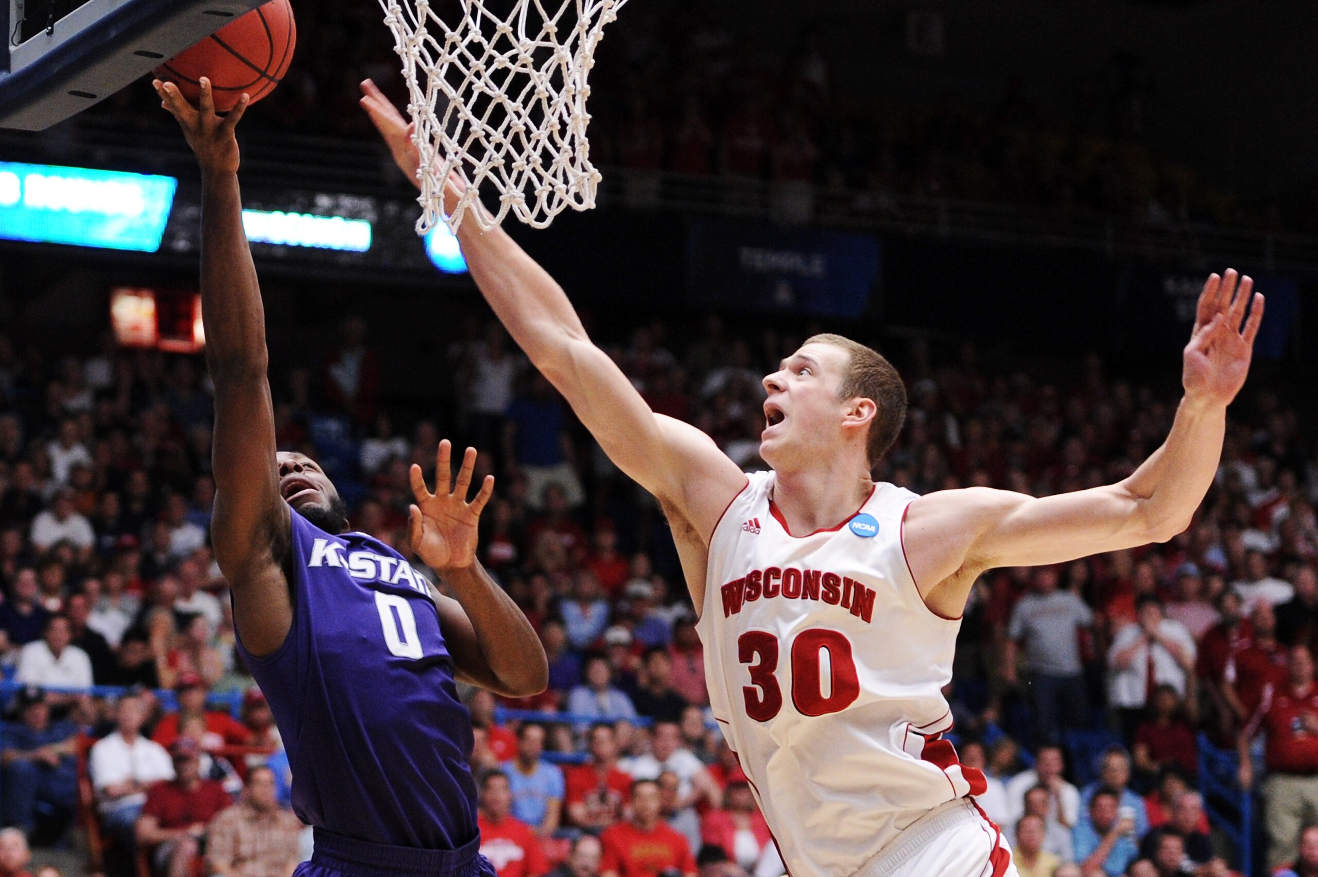 TUCSON, AZ - MARCH 19: Jacob Pullen #0 of the Kansas State Wildcats shoots against Jon Leuer #30 of the Wisconsin Badgers in the second half during the third round of the 2011 NCAA men's basketball tournament at McKale Center on March 19, 2011 in Tucson, TUCSON, AZ - MARCH 19: Jacob Pullen #0 of the Kansas State Wildcats shoots against Jon Leuer #30 of the Wisconsin Badgers in the second half during the third round of the 2011 NCAA men's basketball tournament at McKale Center on March 19, 2011 in Tucson,