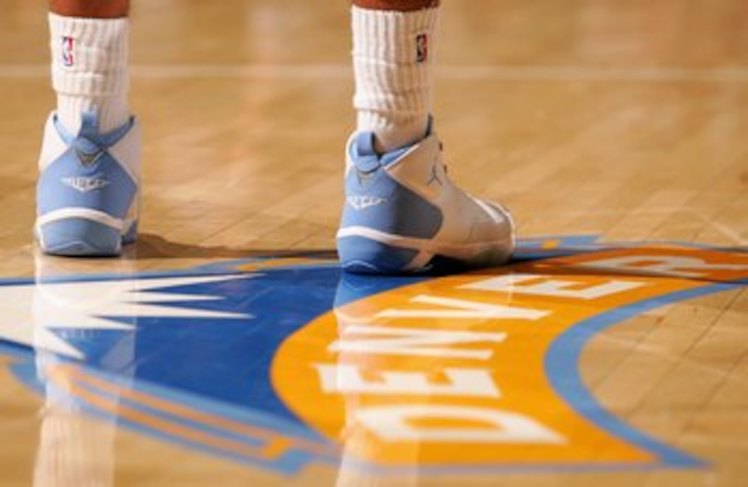 DENVER - NOVEMBER 03:  Carmelo Anthony #15 of the Denver Nuggets takes to the court in his signature shoes as the Minnesota Timberwolves defeated the Nuggets 112-109 on November 3, 2006 at the Pepsi Center in Denver, Colorado. NOTE TO USER: User expressly