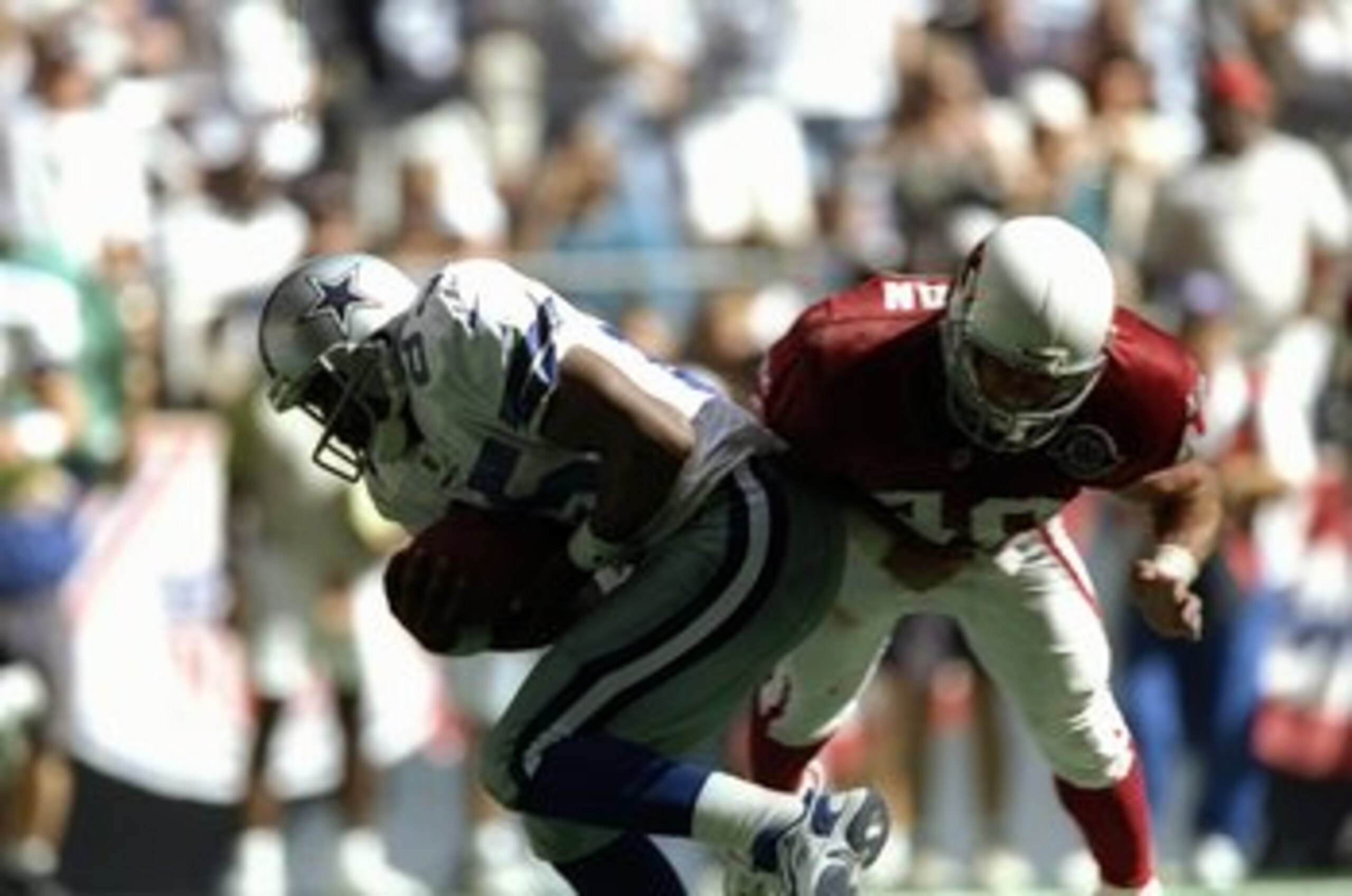 6 Sep 1998:  Wide receiver Ernie Mills #85 of the Dallas Cowboys in action against defensive back Pat Tillman #40 of the Arizona Cardinals  during the game at Texas Stadium in Irving, Texas. The Cowboys defeated the Cardinals 38-10. Mandatory Credit: Step
