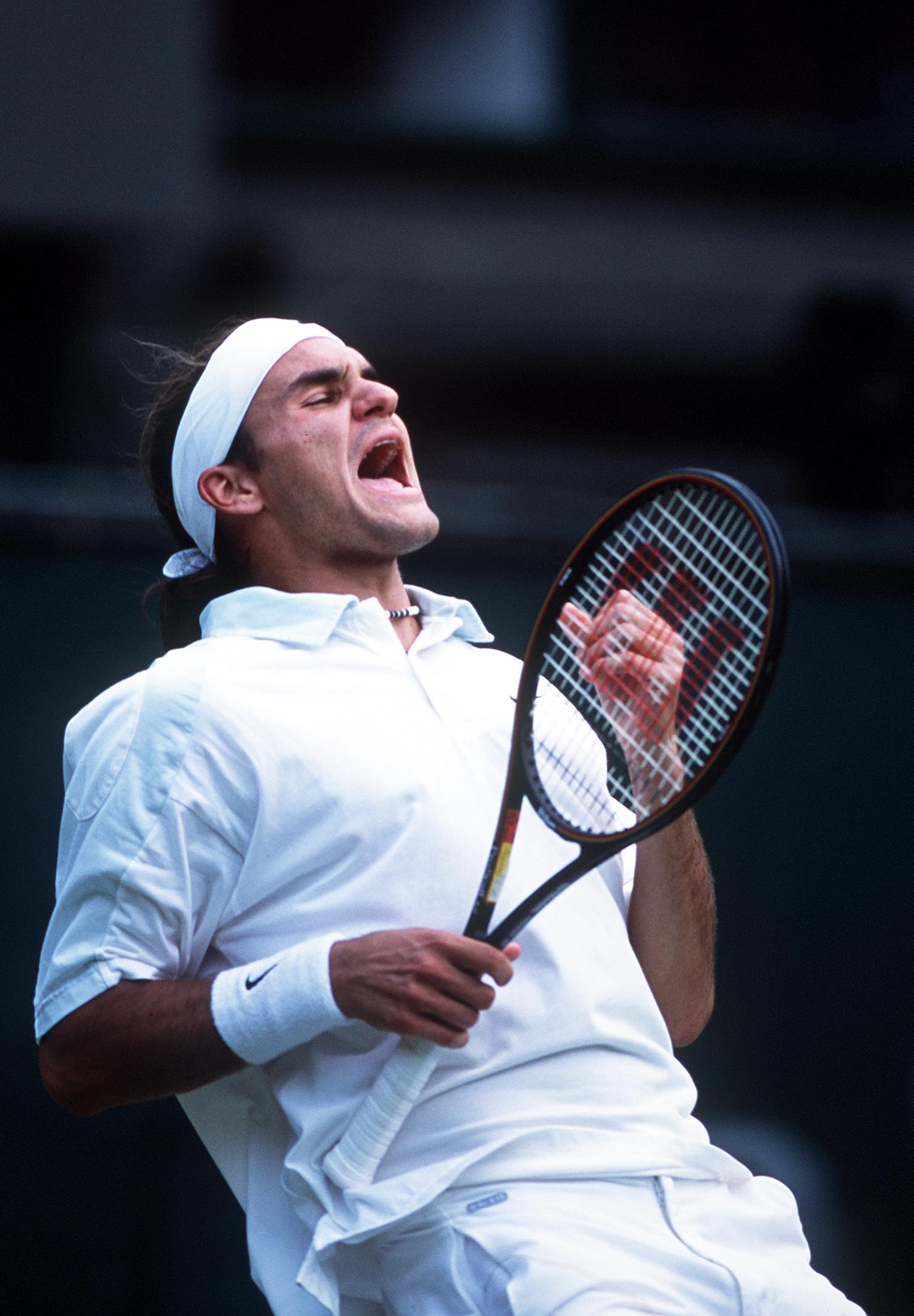 2 Jul 2001:  Roger Federer of Switzerland celebrates his victory over Pete Sampras of the USA during the men's fourth round of The All England Lawn Tennis Championship at Wimbledon, London.  DIGITAL IMAGE Mandatory Credit: Clive Brunskill/ALLSPORT