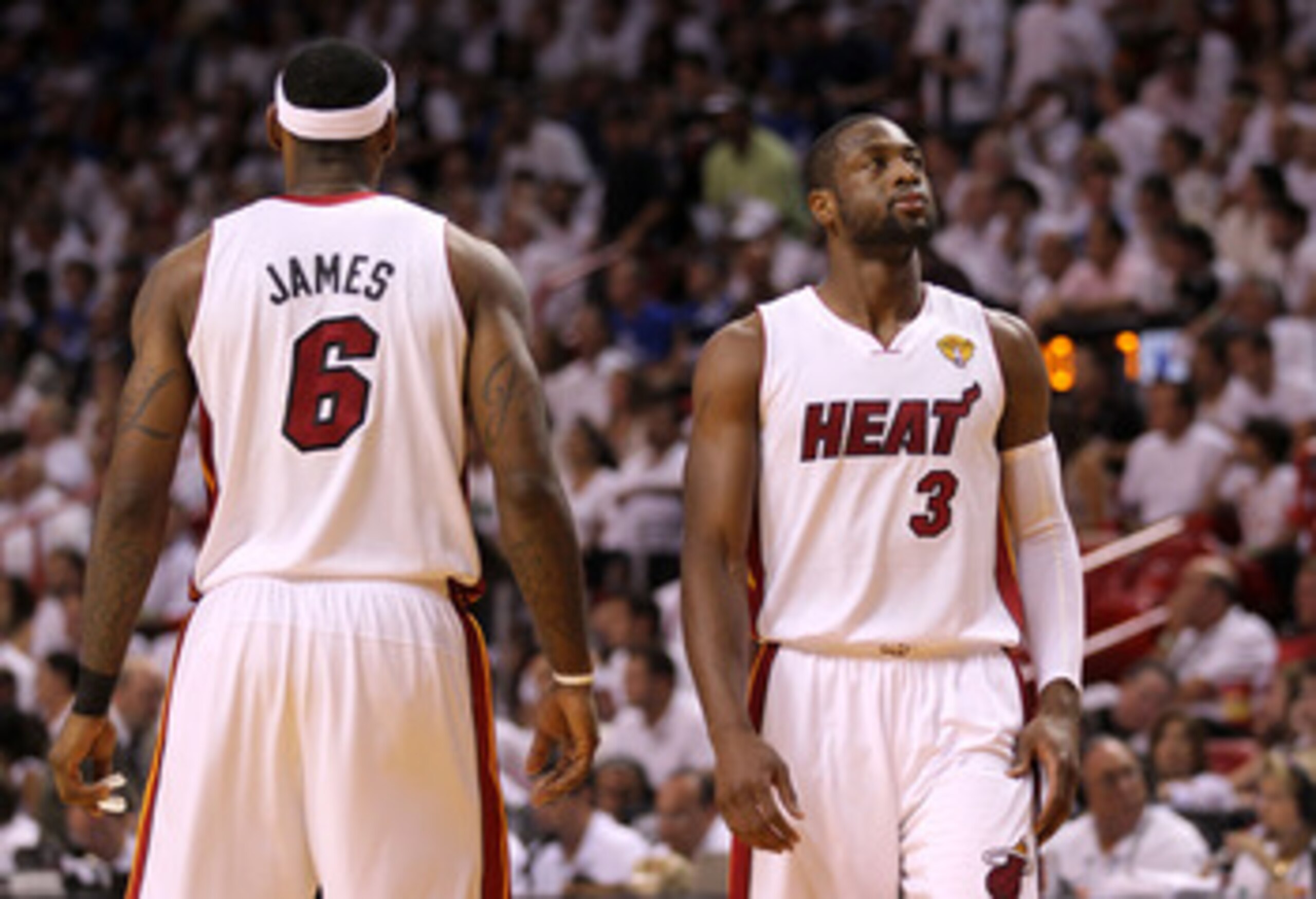 MIAMI, FL - JUNE 12:  Dwyane Wade #3 (R) and LeBron James #6 of the Miami Heat stand on court against the Dallas Mavericks in Game Six of the 2011 NBA Finals at American Airlines Arena on June 12, 2011 in Miami, Florida. NOTE TO USER: User expressly ackno