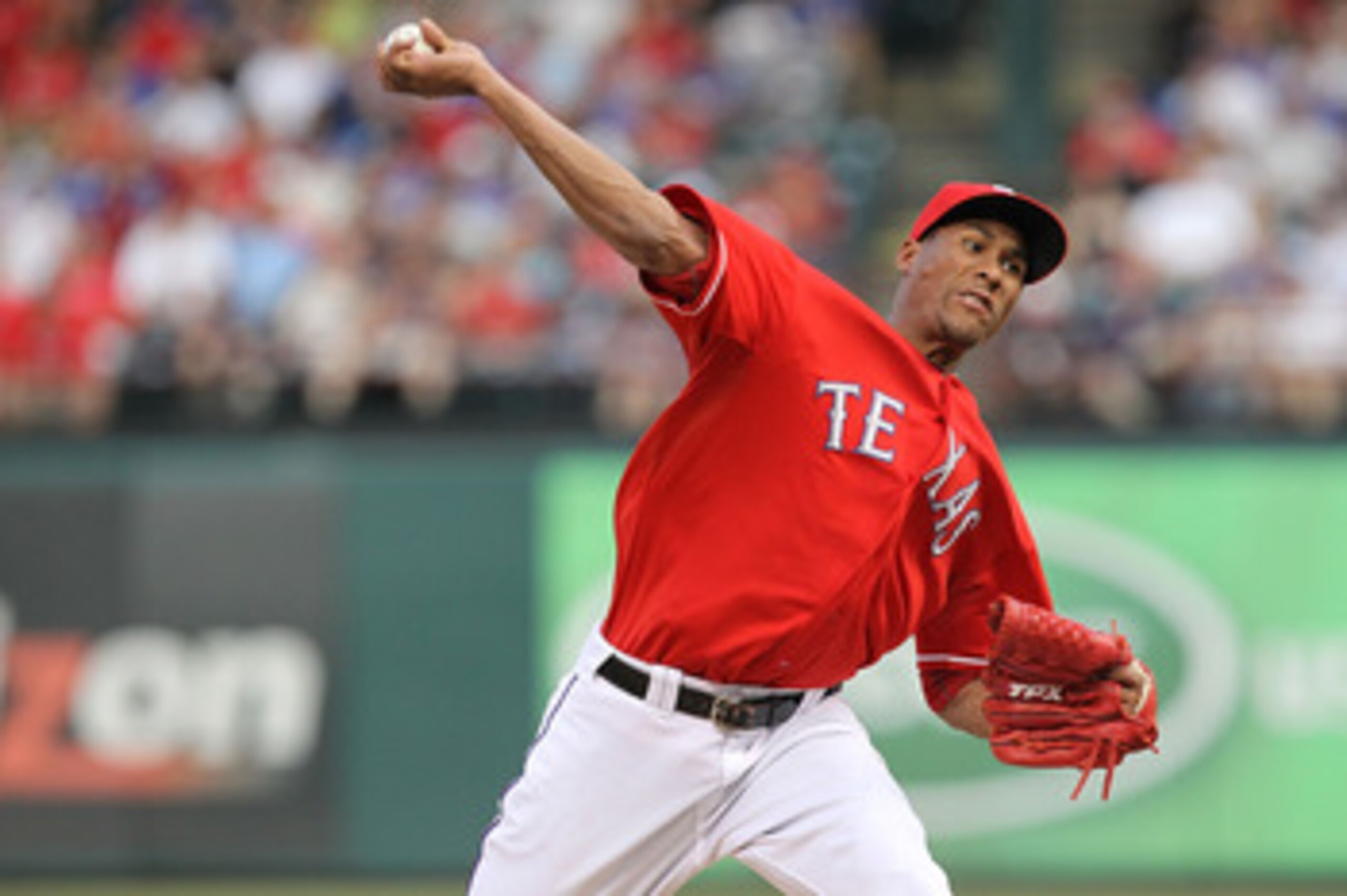 ARLINGTON, TX - JUNE 08:  Pitcher Alexi Ogando #41 of the Texas Rangers throws against the Detroit Tigers at Rangers Ballpark in Arlington on June 8, 2011 in Arlington, Texas.  (Photo by Ronald Martinez/Getty Images)