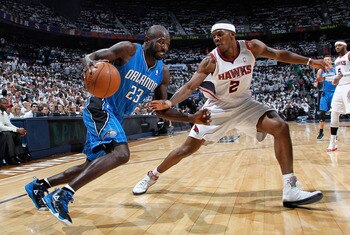 ATLANTA, GA - APRIL 22:  Jason Richardson #23 of the Orlando Magic against Joe Johnson #2 of the Atlanta Hawks during Game Three of the Eastern Conference Quarterfinals in the 2011 NBA Playoffs at Philips Arena on April 22, 2011 in Atlanta, Georgia.  NOTE