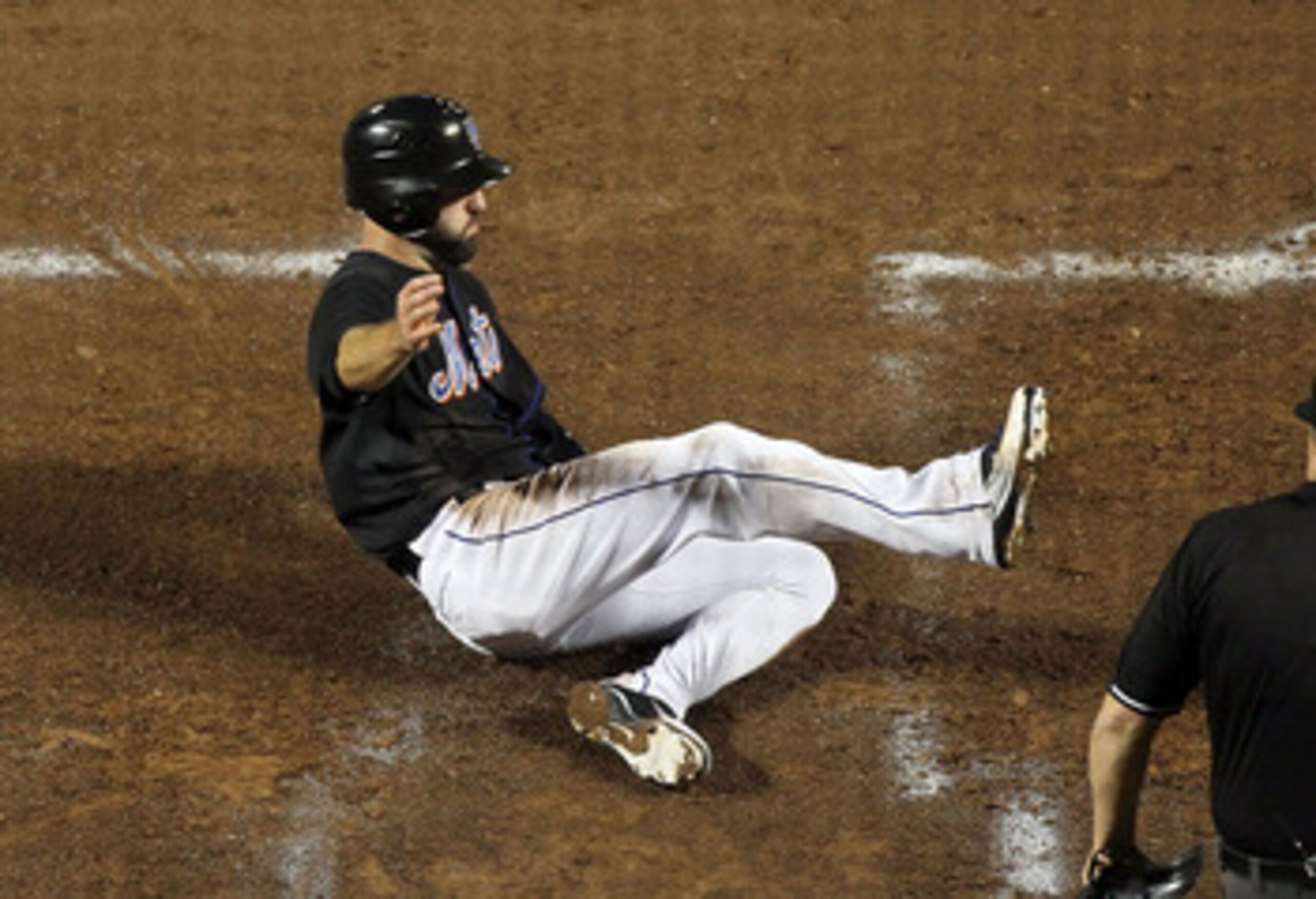NEW YORK, NY - JUNE 05:  Jason Pridie #20 of the New York Mets slides home safely for a second inning run against the Atlanta Braves on June 5, 2011 at Citi Field in the Flushing neighborhood of the Queens borough of New York City.  (Photo by Jim McIsaac/