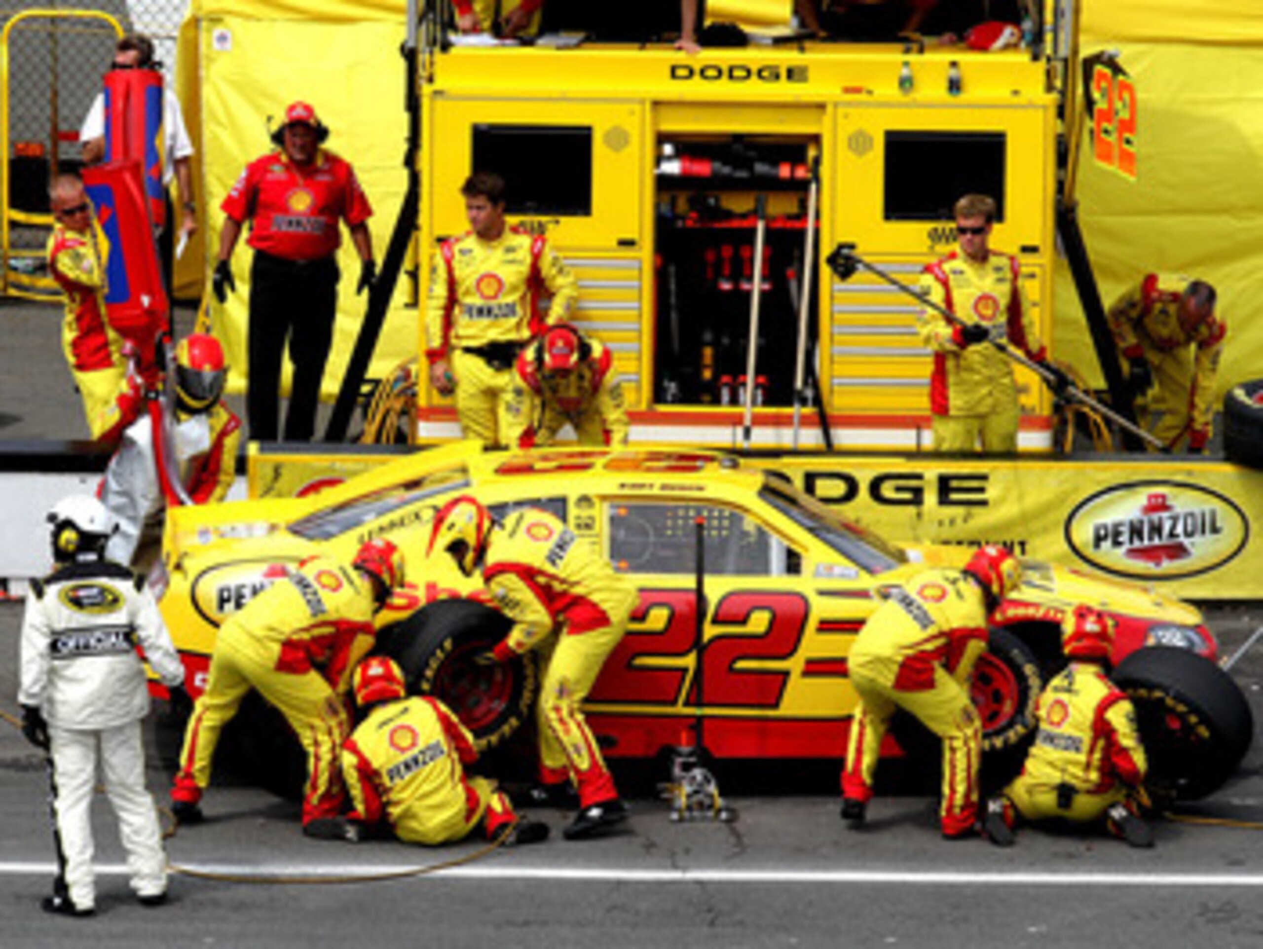 LONG POND, PA - JUNE 12:  Kurt Busch, driver of the #22 Shell/Pennzoil Dodge, makes a pit stop during the NASCAR Sprint Cup Series 5-Hour Energy 500 at Pocono Raceway on June 12, 2011 in Long Pond, Pennsylvania.  (Photo by Jerry Markland/Getty Images for 