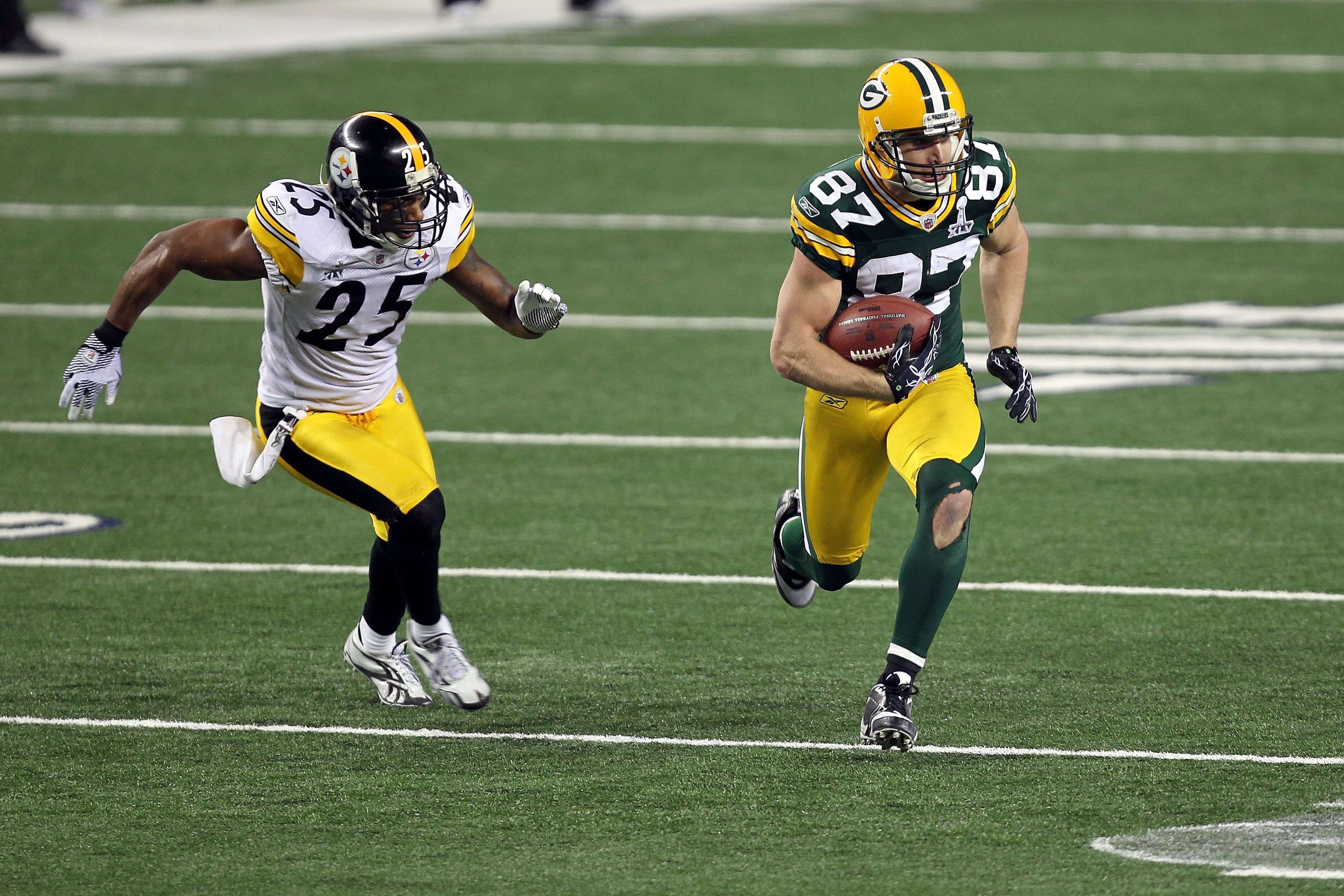 ARLINGTON, TX - FEBRUARY 06:  Jordy Nelson #87 of the Green Bay Packers runs for yards after the catch against Ryan Clark #25 of the Pittsburgh Steelers during Super Bowl XLV at Cowboys Stadium on February 6, 2011 in Arlington, Texas.  (Photo by Mike Ehrm