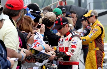 LONG POND, PA - JUNE 11:  Greg Biffle, driver of the #16 3M Ford, signs autographs during qualifying for the NASCAR Sprint Cup Series 5-Hour Energy 500 at Pocono Raceway on June 11, 2011 in Long Pond, Pennsylvania.  (Photo by Jerry Markland/Getty Images f