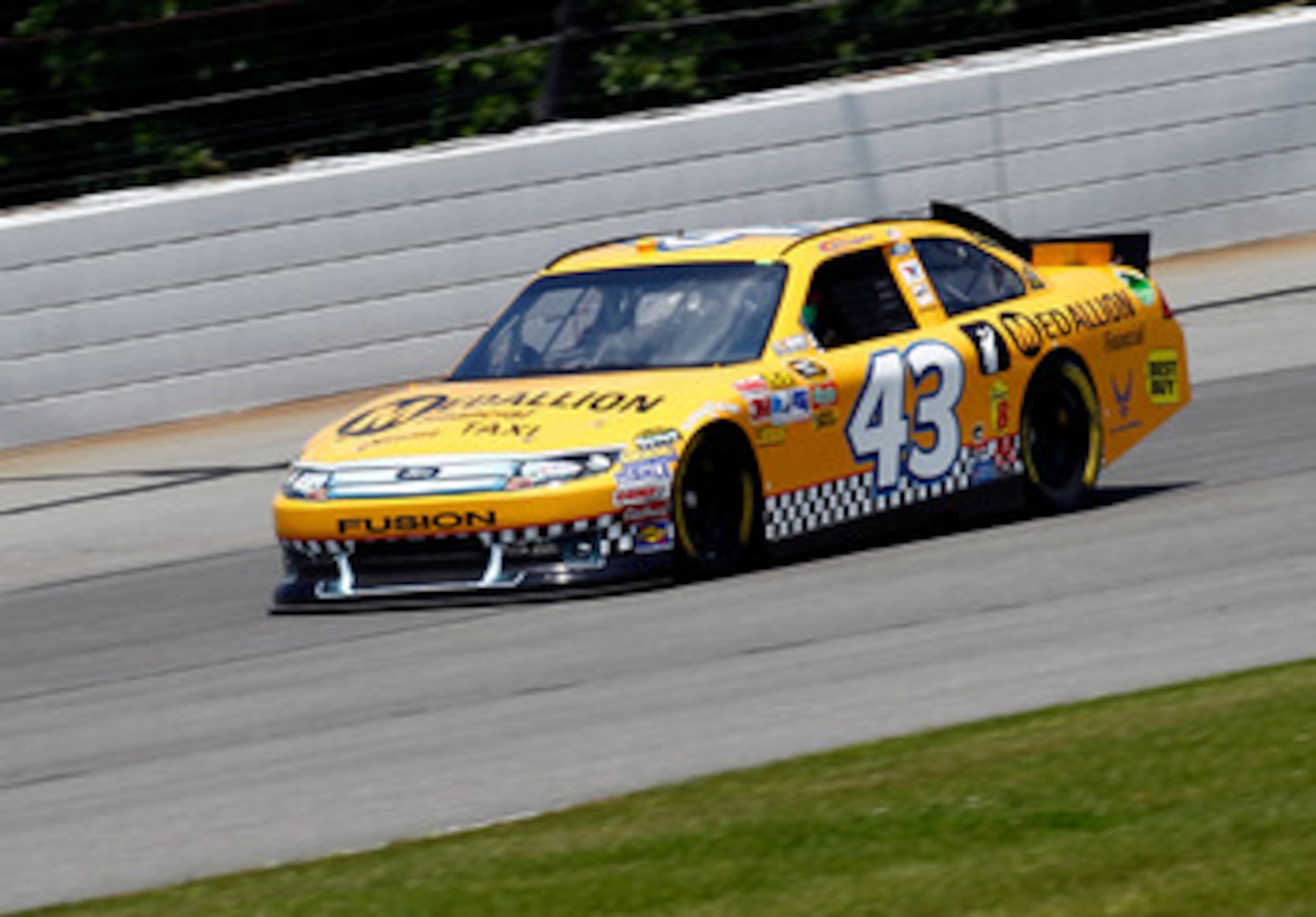 LONG POND, PA - JUNE 10:  A.J. Allmendinger, driver of the #43 Medallion Financial Ford, practices for the NASCAR Sprint Cup Series 5-Hour Energy 500 at Pocono Raceway on June 10, 2011 in Long Pond, Pennsylvania.  (Photo by Jeff Zelevansky/Getty Images fo