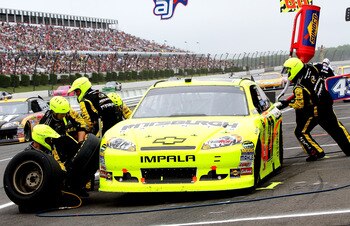 LONG POND, PA - JUNE 12:  Paul Menard, driver of the #27 Pittsburgh Paints/Menards Chevrolet, makes a pit stop during the NASCAR Sprint Cup Series 5-Hour Energy 500 at Pocono Raceway on June 12, 2011 in Long Pond, Pennsylvania.  (Photo by Jerry Markland/G