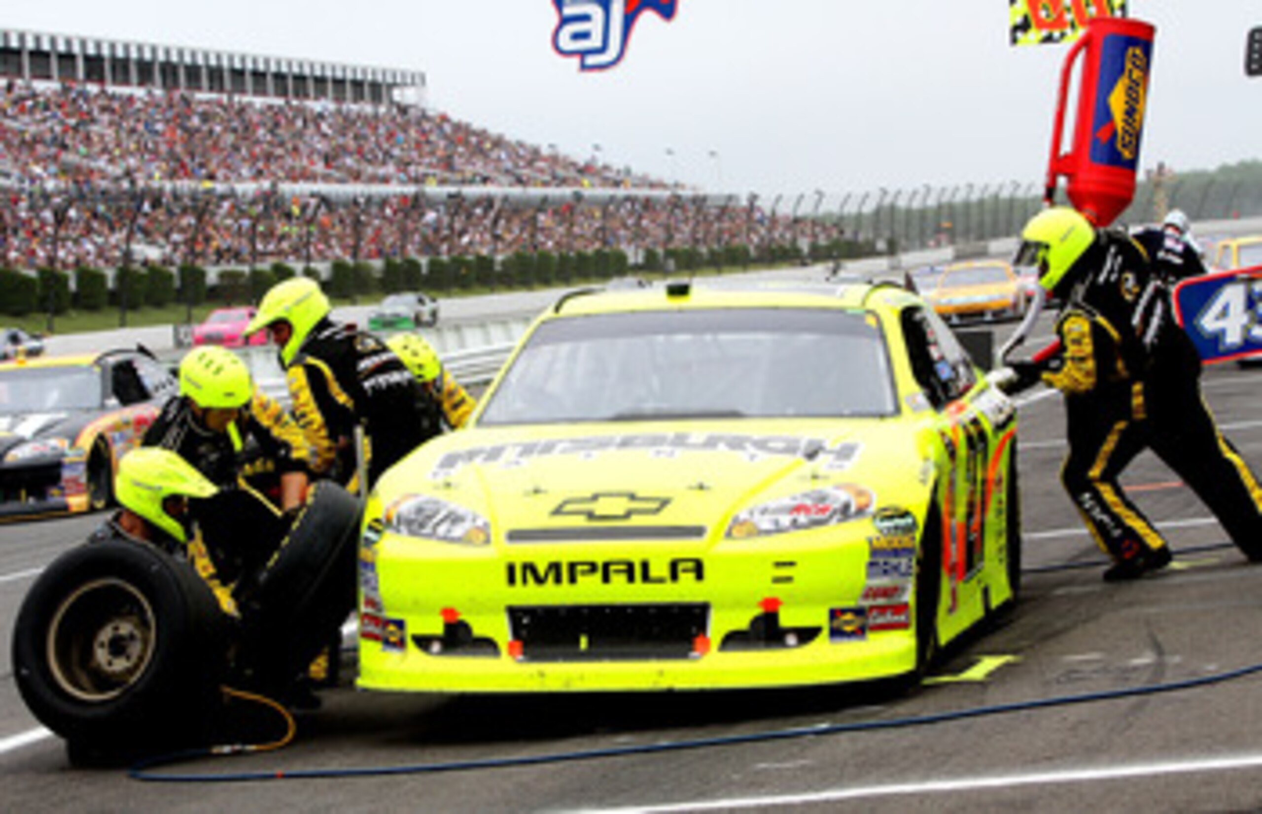 LONG POND, PA - JUNE 12:  Paul Menard, driver of the #27 Pittsburgh Paints/Menards Chevrolet, makes a pit stop during the NASCAR Sprint Cup Series 5-Hour Energy 500 at Pocono Raceway on June 12, 2011 in Long Pond, Pennsylvania.  (Photo by Jerry Markland/G