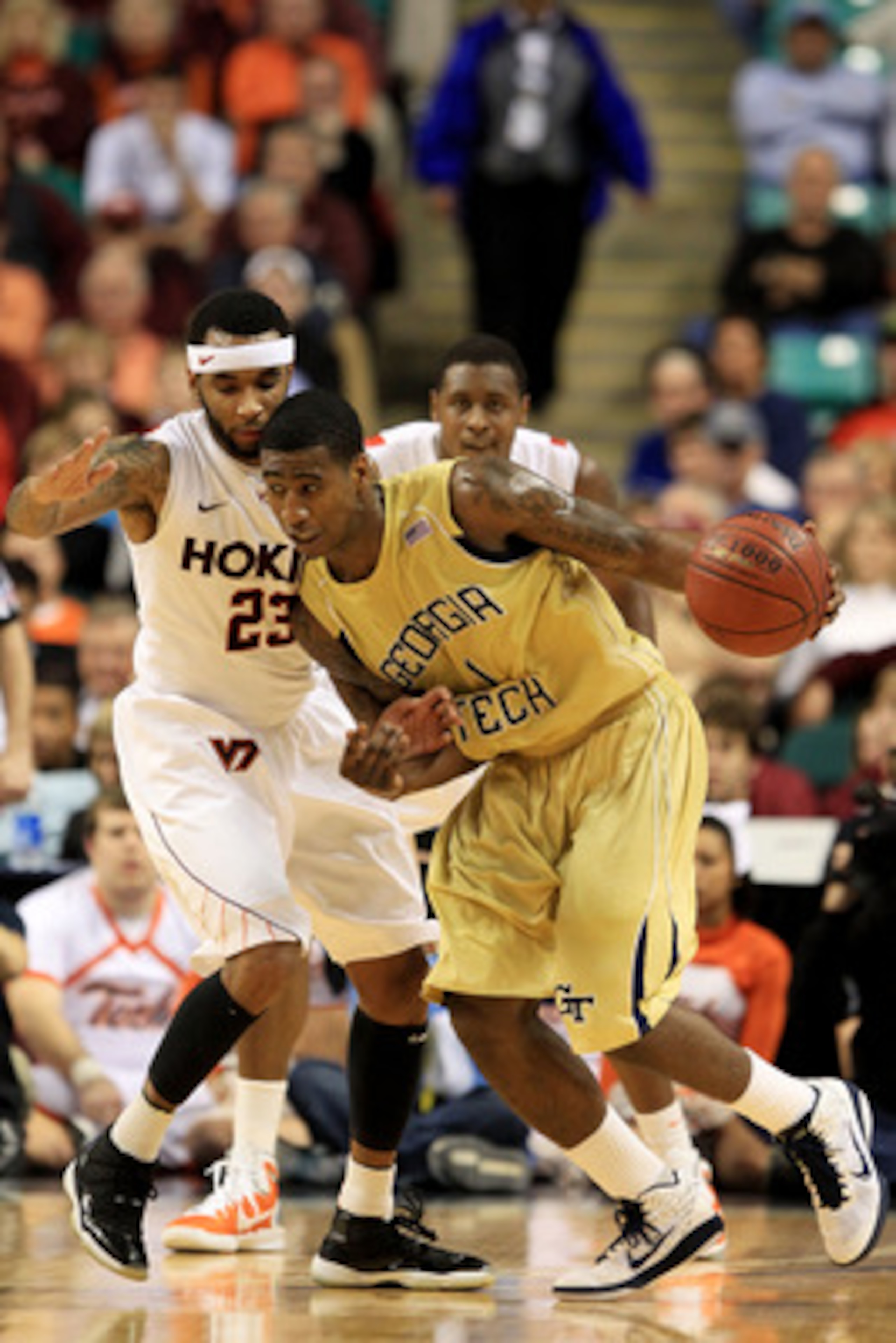 GREENSBORO, NC - MARCH 10:  Iman Shumpert #1 of the Georgia Tech Yellow Jackets drives against Malcolm Delaney #23 of the Virginia Tech Hokies during the first half of the game in the first round of the 2011 ACC men's basketball tournament at the Greensbo