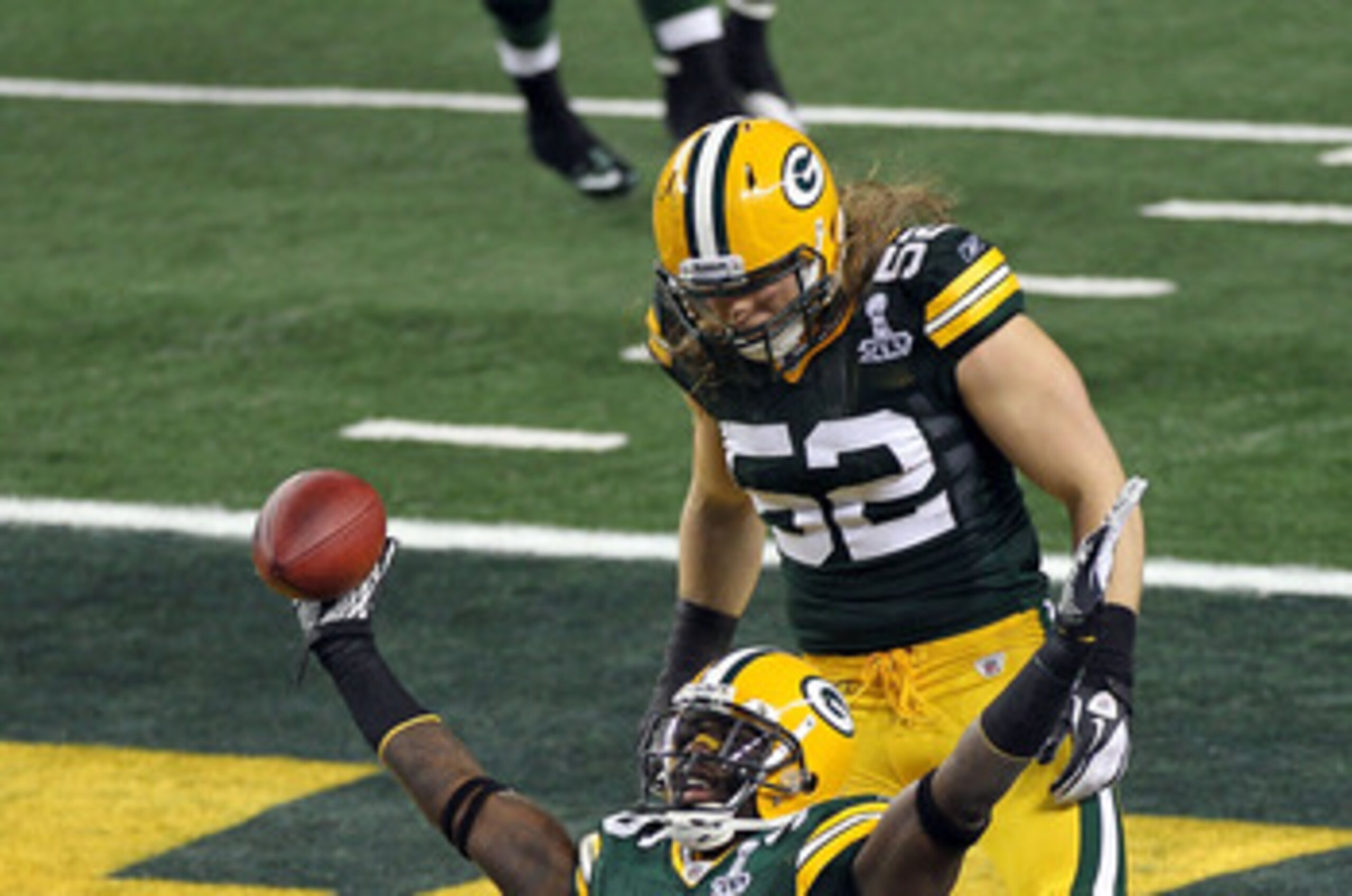 ARLINGTON, TX - FEBRUARY 06:  Nick Collins #36 of the Green Bay Packers celebrates with teammate Clay Matthews #52 after Collins returned an interception for a touchdown against the Pittsburgh Steelers during Super Bowl XLV at Cowboys Stadium on February