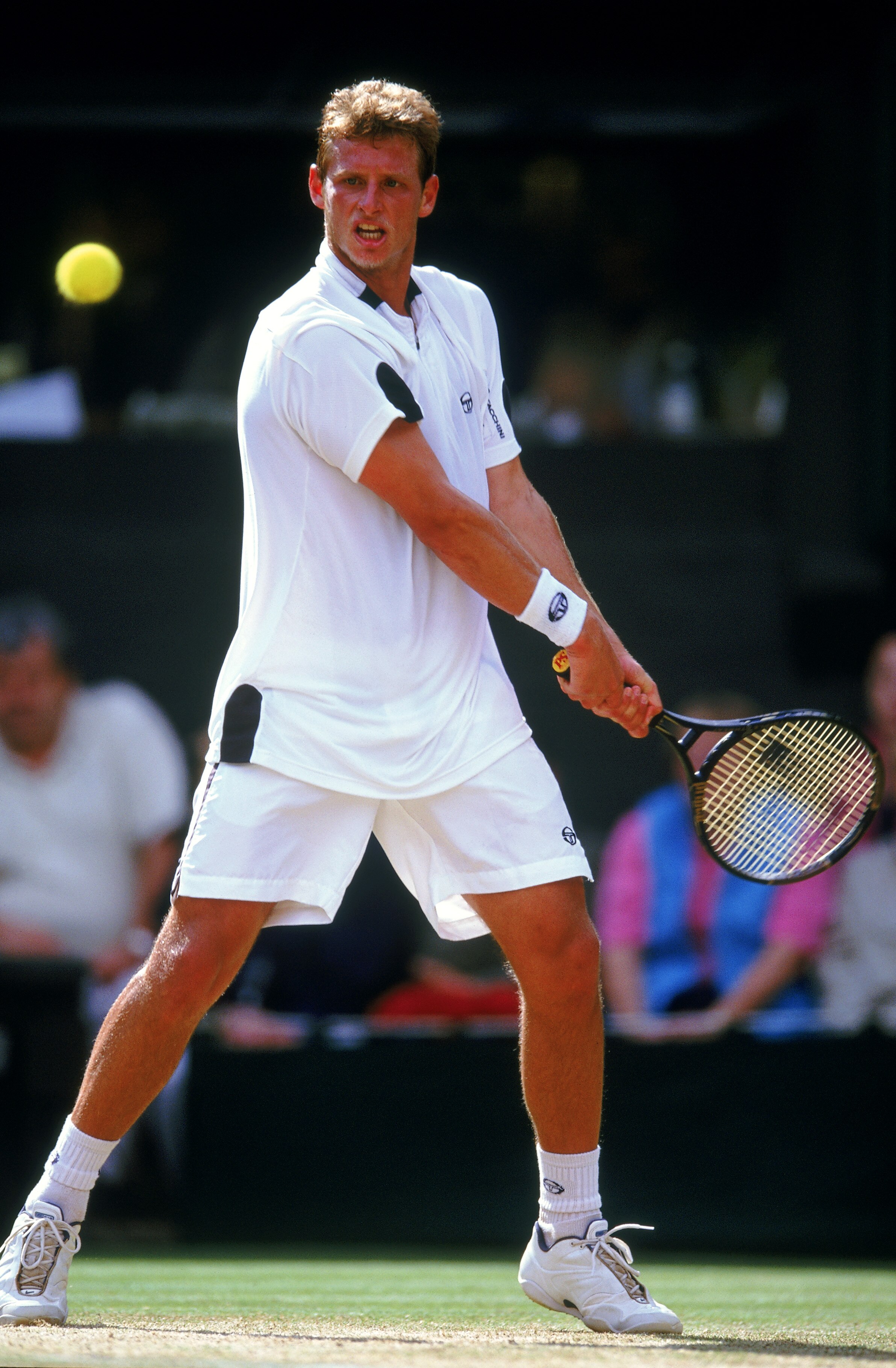 WIMBLEDON - 7 JULY:  David Nalbandian of Argentina hits a backhand on his way to defeat against Lleyton Hewitt of Australia in the Men's Singles Final of the Lawn Tennis Championships at the All England Club in Wimbledon, England on July 7, 2002. Hewitt w