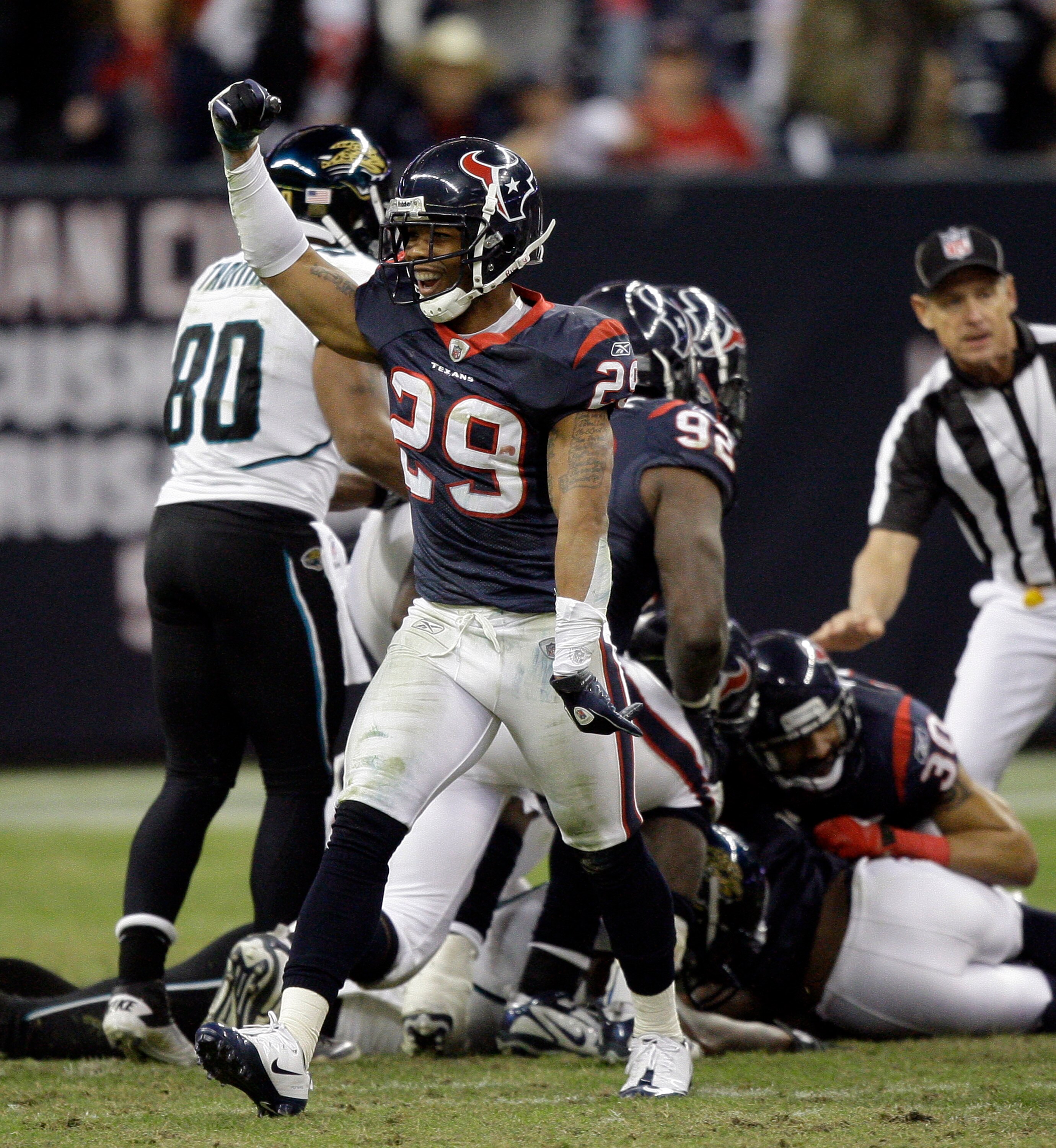 HOUSTON - JANUARY 02:  Glover Quin #29 of the Houston Texans celebrates after recovering a fumble late in the fourth quarter against the Jacksonville Jaguars at Reliant Stadium on January 2, 2011 in Houston, Texas.  (Photo by Bob Levey/Getty Images)