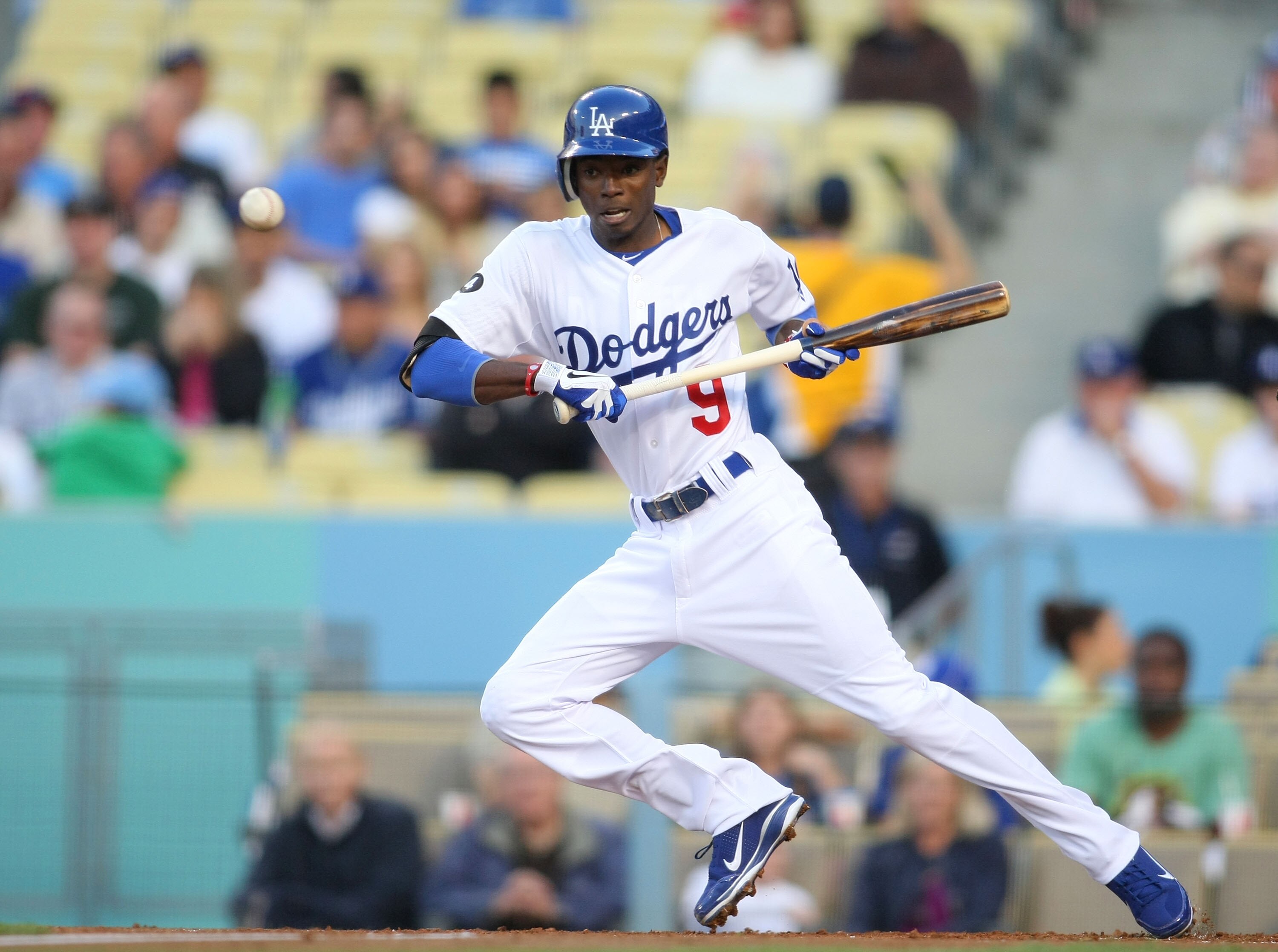 LOS ANGELES, CA - JUNE 13: Dee Gordon #9 of the Los Angeles Dodgers bunts in the first inning against the Cincinnati Reds during the MLB game at Dodger Stadium on June 13, 2011 in Los Angeles, California. (Photo by Victor Decolongon/Getty Images) LOS ANGELES, CA - JUNE 13: Dee Gordon #9 of the Los Angeles Dodgers bunts in the first inning against the Cincinnati Reds during the MLB game at Dodger Stadium on June 13, 2011 in Los Angeles, California. (Photo by Victor Decolongon/Getty Images)