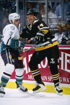 25 Sep 1996:  Rightwinger Brad Lauer of the Pittsburgh Penguins (right) and Anaheim Mighty Ducks defenseman Jason York tangle up during a game at Arrowhead Pond in Anaheim, California.  The Ducks won the game, 6-1. Mandatory Credit: Glenn Cratty  /Allspor