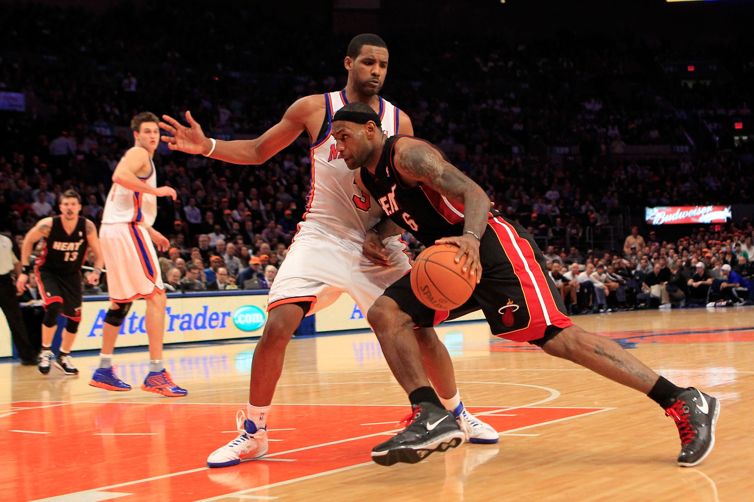 NEW YORK, NY - JANUARY 27:  LeBron James #6 of the Miami Heat drives past Shawne Williams #3 of the New York Knicks at Madison Square Garden on January 27, 2011 in New York City. NOTE TO USER: User expressly acknowledges and agrees that, by downloading an