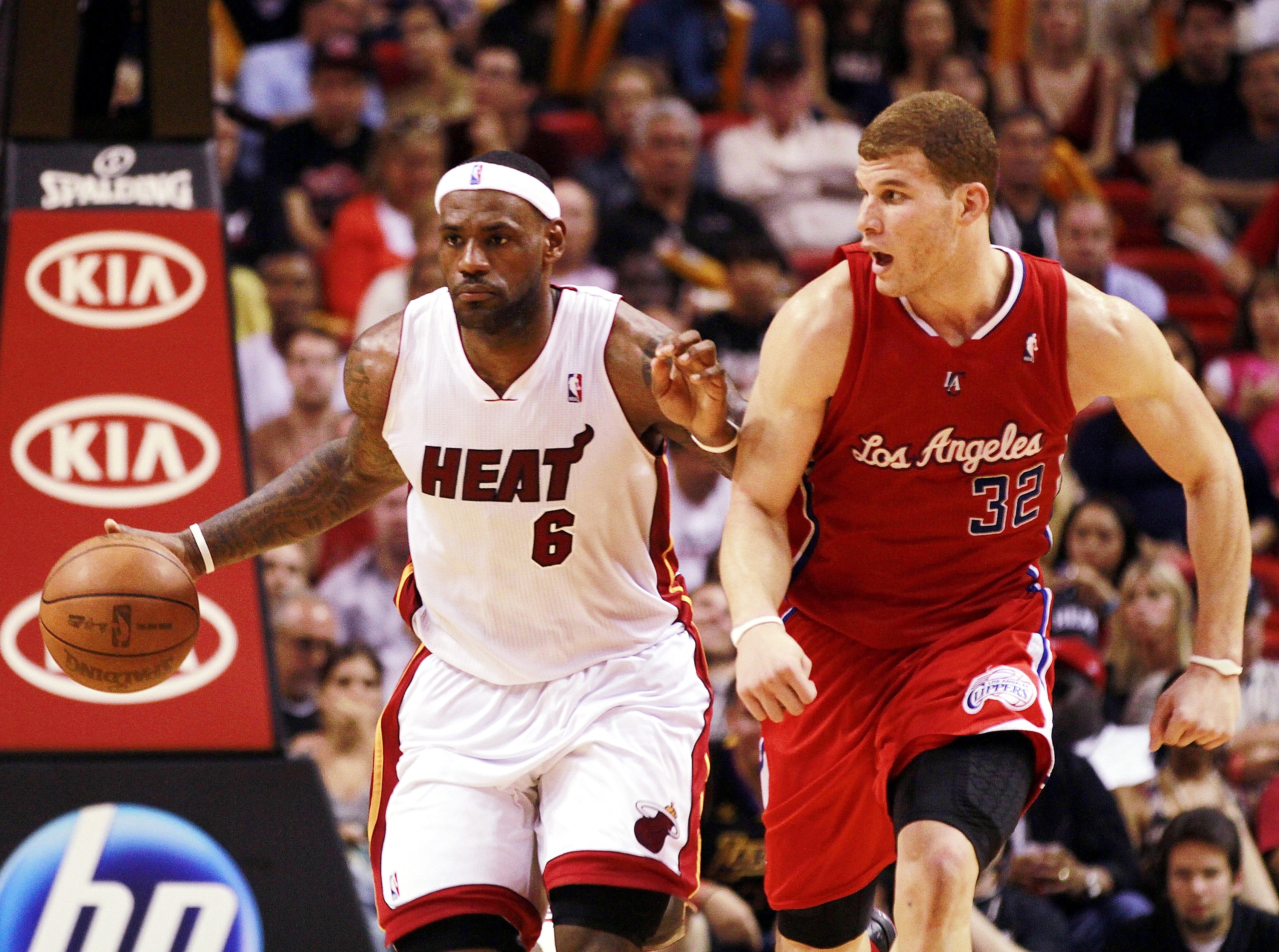 MIAMI - FEBRUARY 06:  Forward LeBron James #6 of the Miami Heat drives against guard Forward Blake Griffin #32 of the L.A. Clippers at American Airlines Arena on February 6, 2011 in Miami, Florida. NOTE TO USER: User expressly acknowledges and agrees that