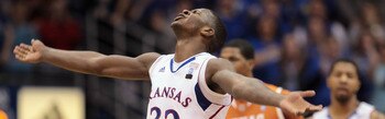 LAWRENCE, KS - JANUARY 22:  Josh Selby #32 of the Kansas Jayhawks reacts after scoring during the game against the Texas Longhorns on January 22, 2011 at Allen Fieldhouse in Lawrence, Kansas.  (Photo by Jamie Squire/Getty Images)