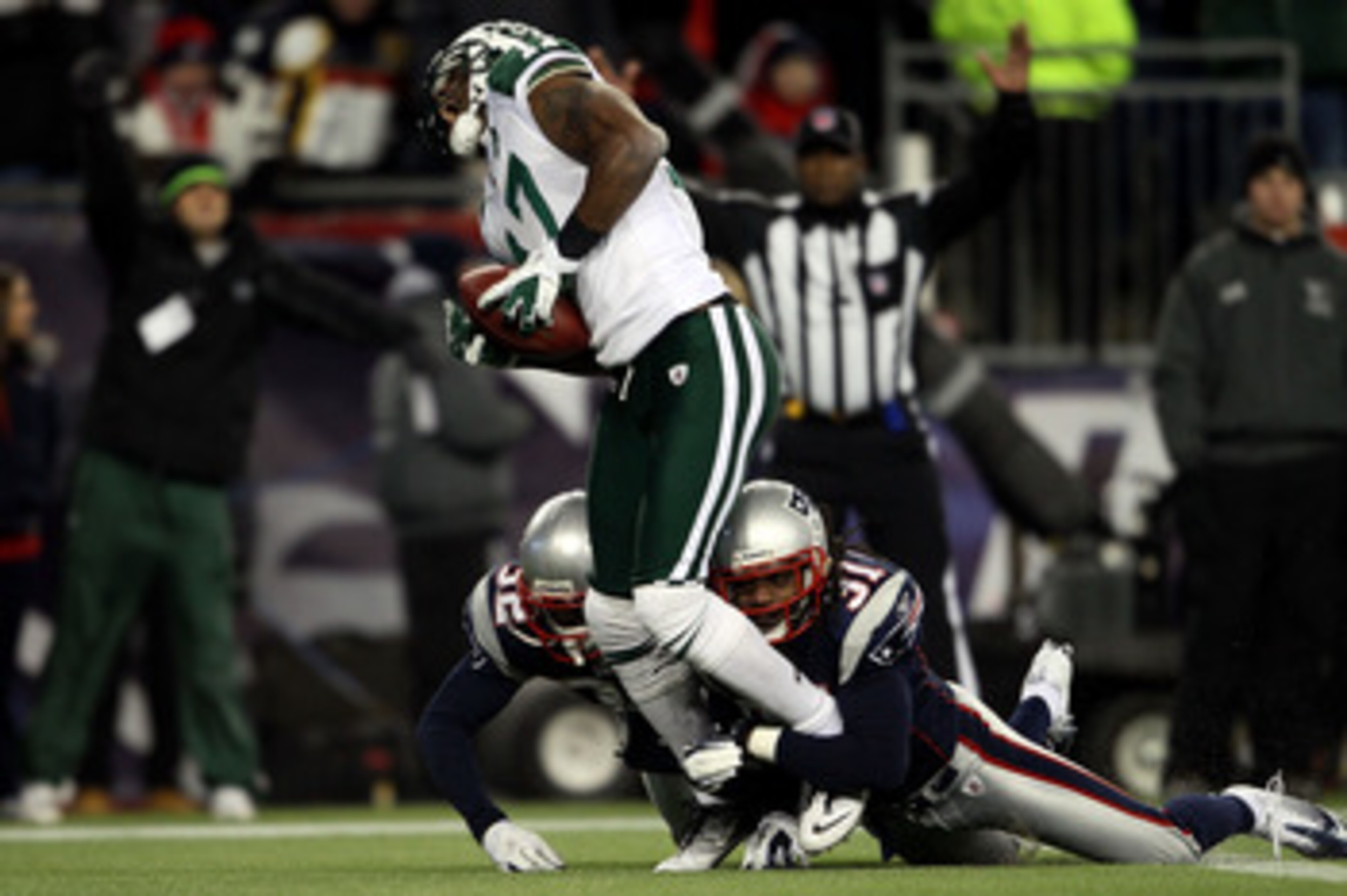 FOXBORO, MA - JANUARY 16: Braylon Edwards #17 of the New York Jets scores a second quarter touchdown as Devin McCourty #32 and Brandon Meriweather #31 of the New England Patriots attempt to tackle during their 2011 AFC divisional playoff game at Gillette FOXBORO, MA - JANUARY 16: Braylon Edwards #17 of the New York Jets scores a second quarter touchdown as Devin McCourty #32 and Brandon Meriweather #31 of the New England Patriots attempt to tackle during their 2011 AFC divisional playoff game at Gillette
