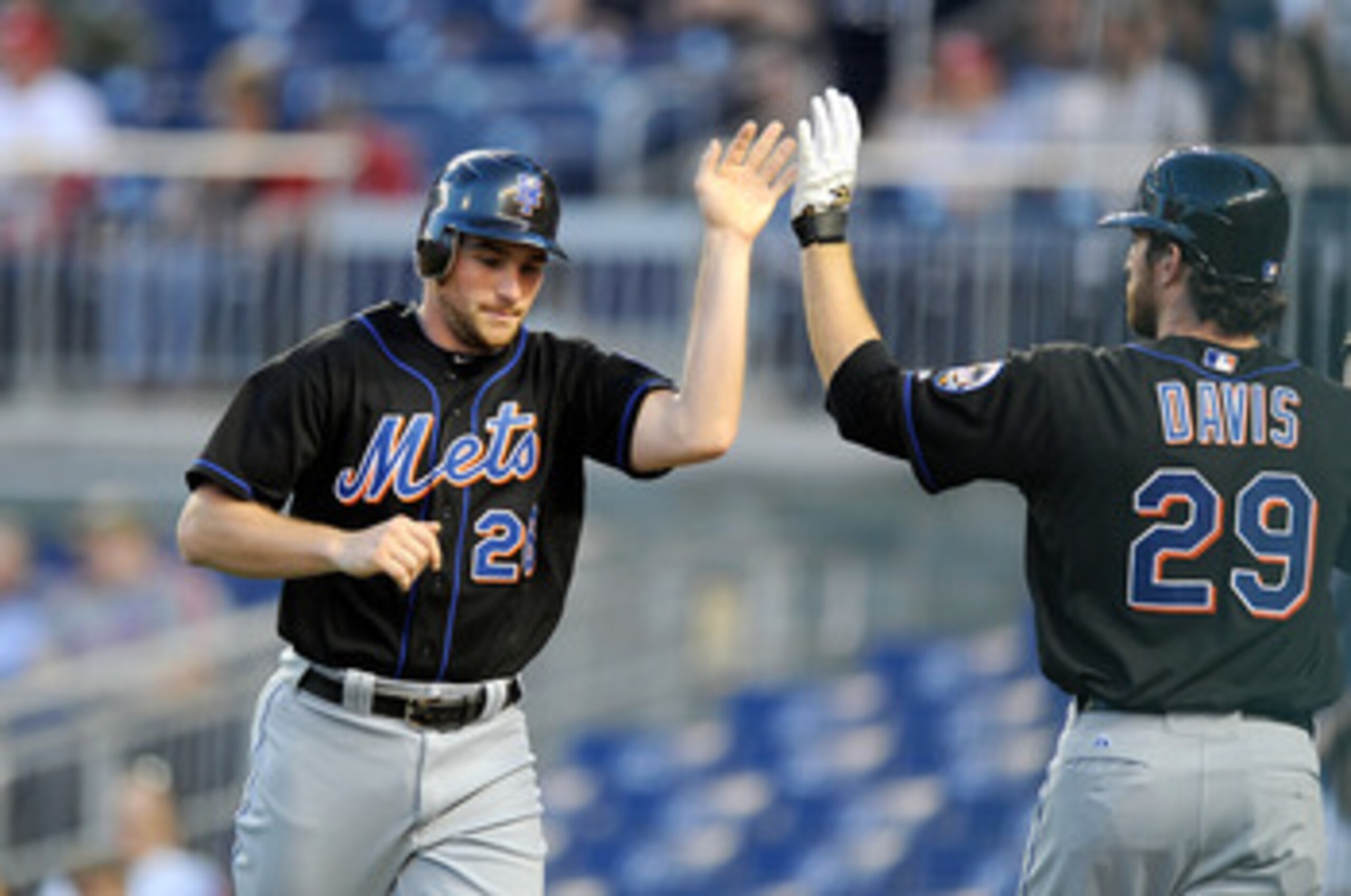 WASHINGTON, DC - APRIL 26:  Daniel Murphy #28 of the New York Mets celebrates with Ike Davis #29 after scoring in the third inning against the Washington Nationals at Nationals Park on April 26, 2011 in Washington, DC.  (Photo by Greg Fiume/Getty Images)