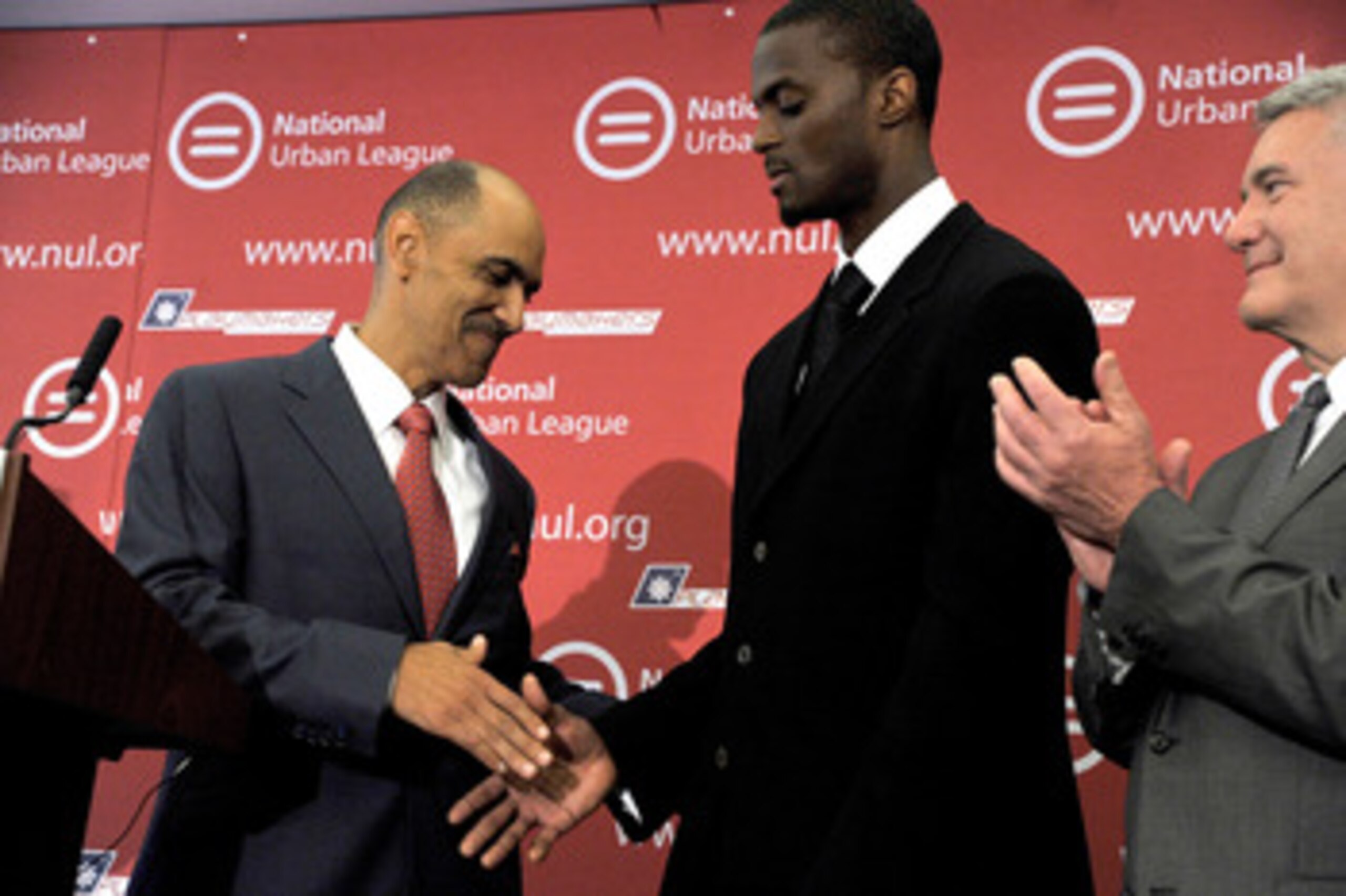 NEW YORK, NY - JUNE 13: (L-R) Former NFL football coach Tony Dungy shakes hands with former NFL wide reciever Plaxico Burress during a press conference  at National Urban League on June 13, 2011 in New York City.  (Photo by Joe Corrigan/Getty Images)
