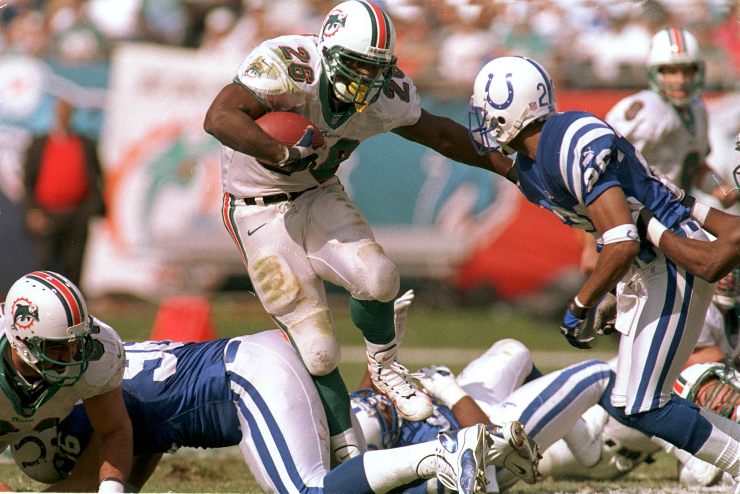 30 Dec 2000:  Lamar Smith #26 of the Miami Dolphins breaks the line for a gain during their game against the Indianapolis Colts at Pro Player Stadium in Miami, Florida. Mandatory Credit: Andy Lyons/ALLSPORT