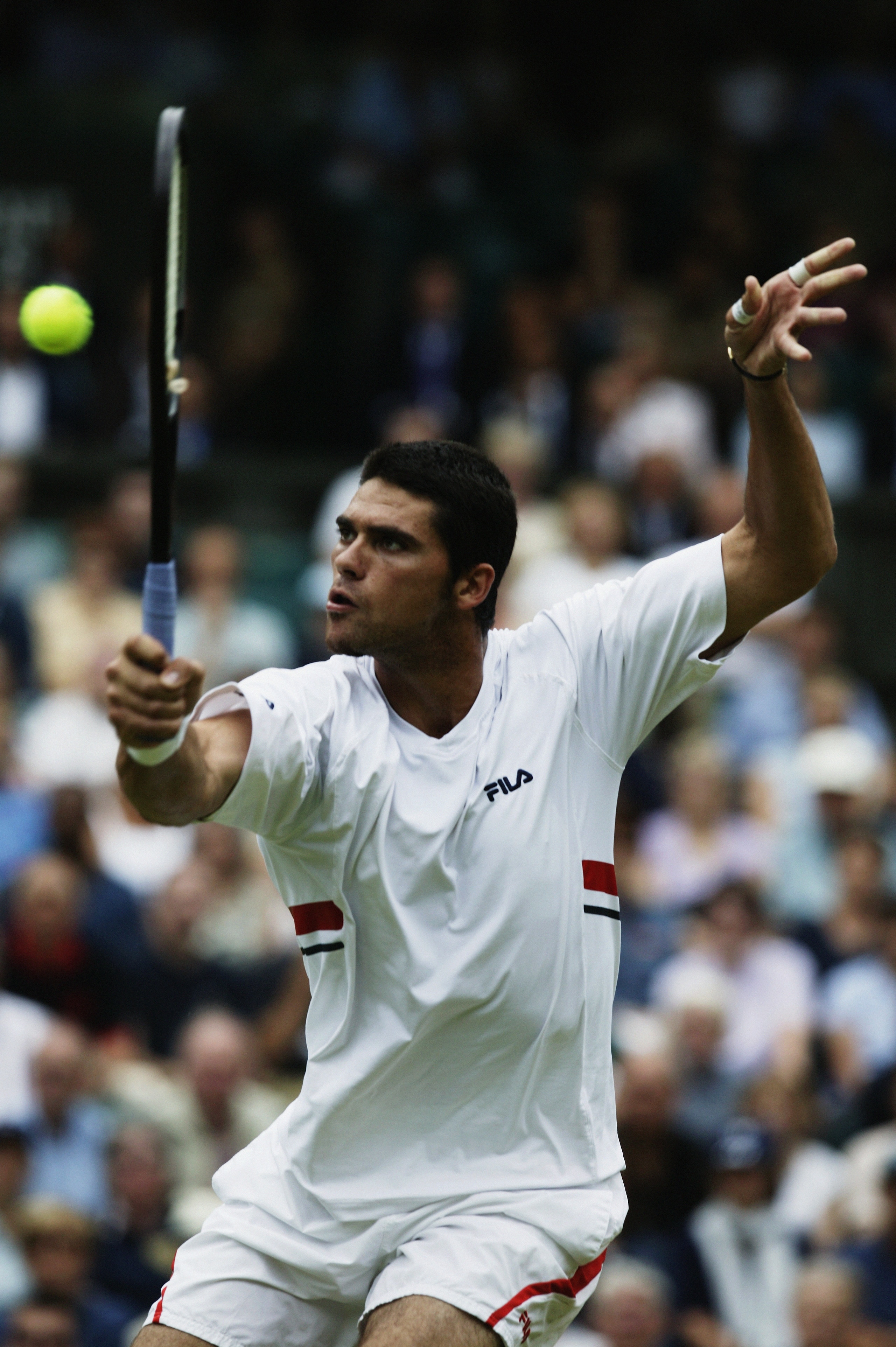 LONDON - JULY 4:  Mark Philippoussis of Australia in action in the Mens Singles semi final during day eleven of the Wimbledon Tennis Championships on July 4, 2003 at the All England Lawn Tennis Club in London, England. (Photo by Phil Cole/Getty Images)