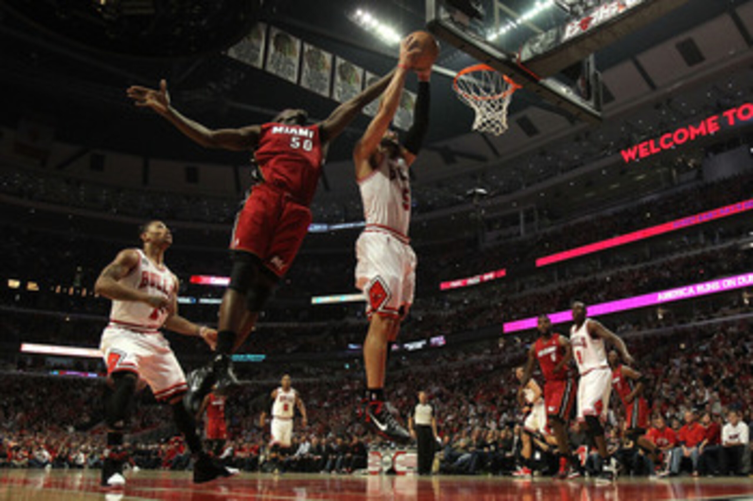 CHICAGO, IL - MAY 26:  Carlos Boozer #5 of the Chicago Bulls controls a rebound against Joel Anthony #50 of the Miami Heat in Game Five of the Eastern Conference Finals during the 2011 NBA Playoffs on May 26, 2011 at the United Center in Chicago, Illinois
