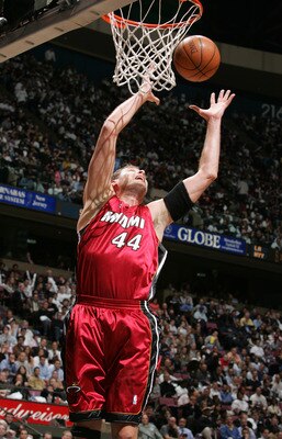 EAST RUTHERFORD - APRIL 28:  Christian Laettner #44 of the Miami Heat tries to control the ball against the New Jersey Nets in Game three of the Eastern Conference Quarterfinals during the 2005 NBA Playoffs April 28, 2005 at Continental Airline Arena in E
