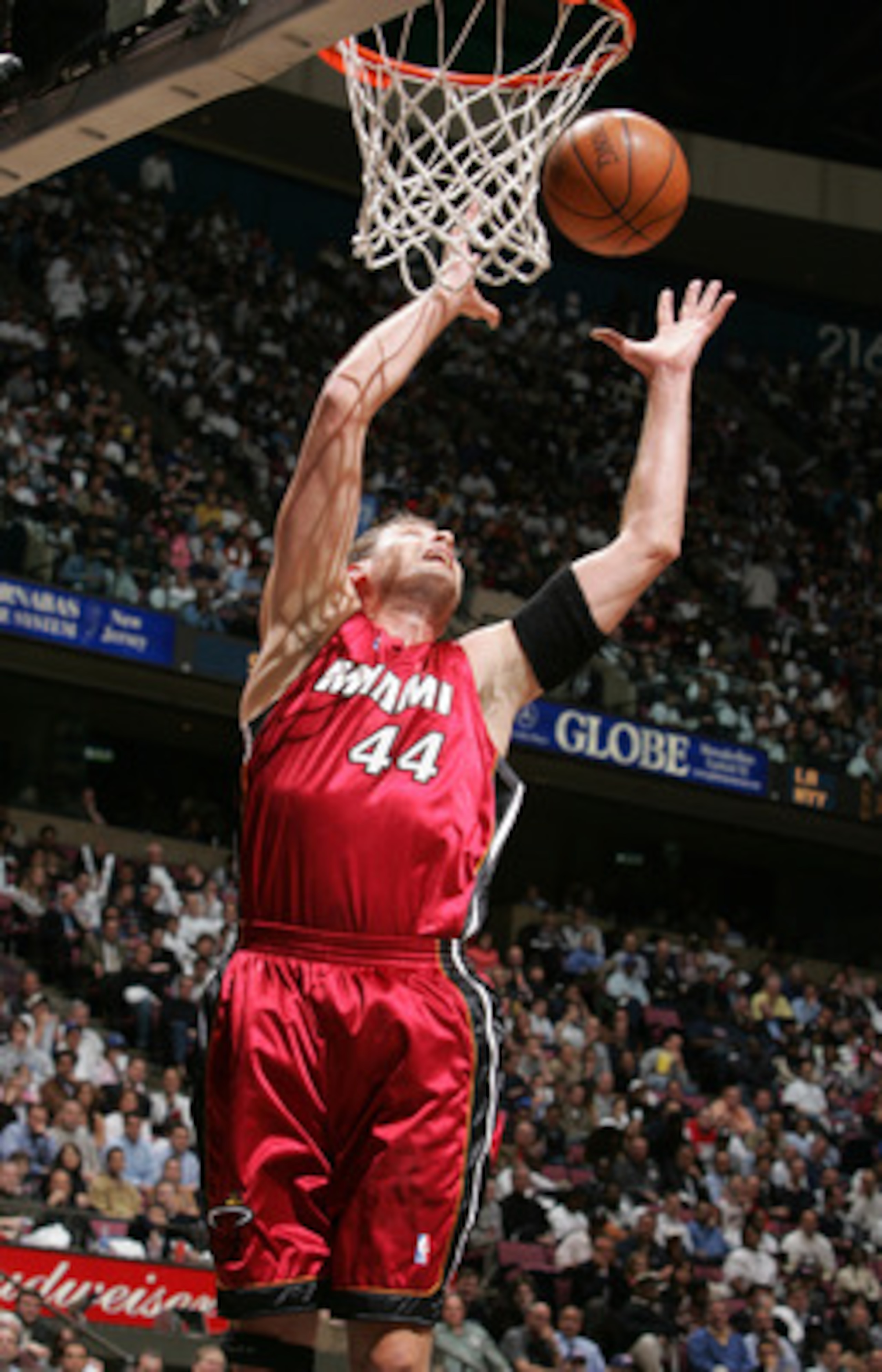 EAST RUTHERFORD - APRIL 28:  Christian Laettner #44 of the Miami Heat tries to control the ball against the New Jersey Nets in Game three of the Eastern Conference Quarterfinals during the 2005 NBA Playoffs April 28, 2005 at Continental Airline Arena in E