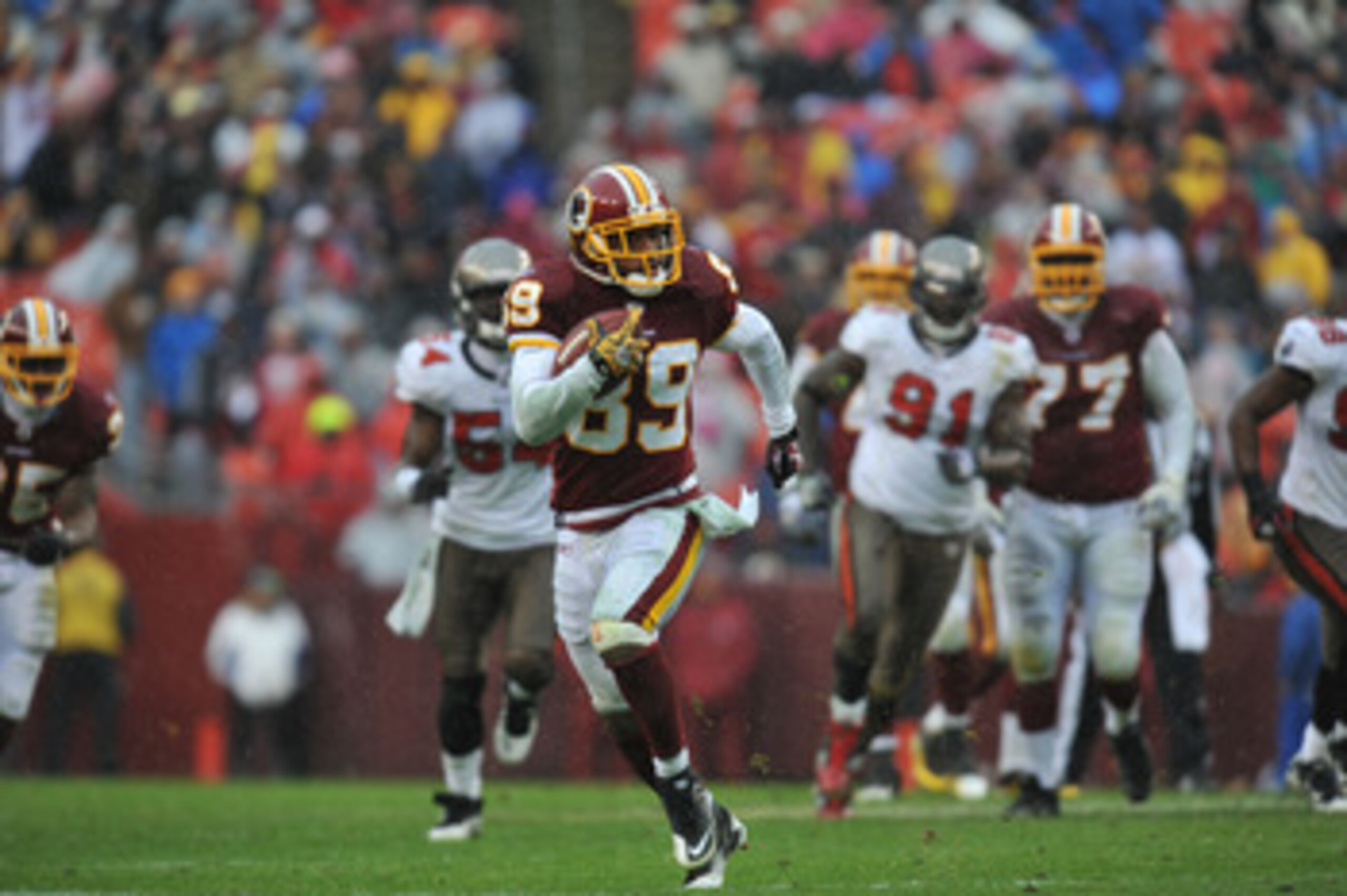 LANDOVER, MD - DECEMBER 12:  Santana Moss #89 of the Washington Redskins runs the ball after a catch during the game against the Tampa Bay Buccaneers  at FedExField on December 12, 2010 in Landover, Maryland. The Buccaneers defeated the Redskins 17-16. (P