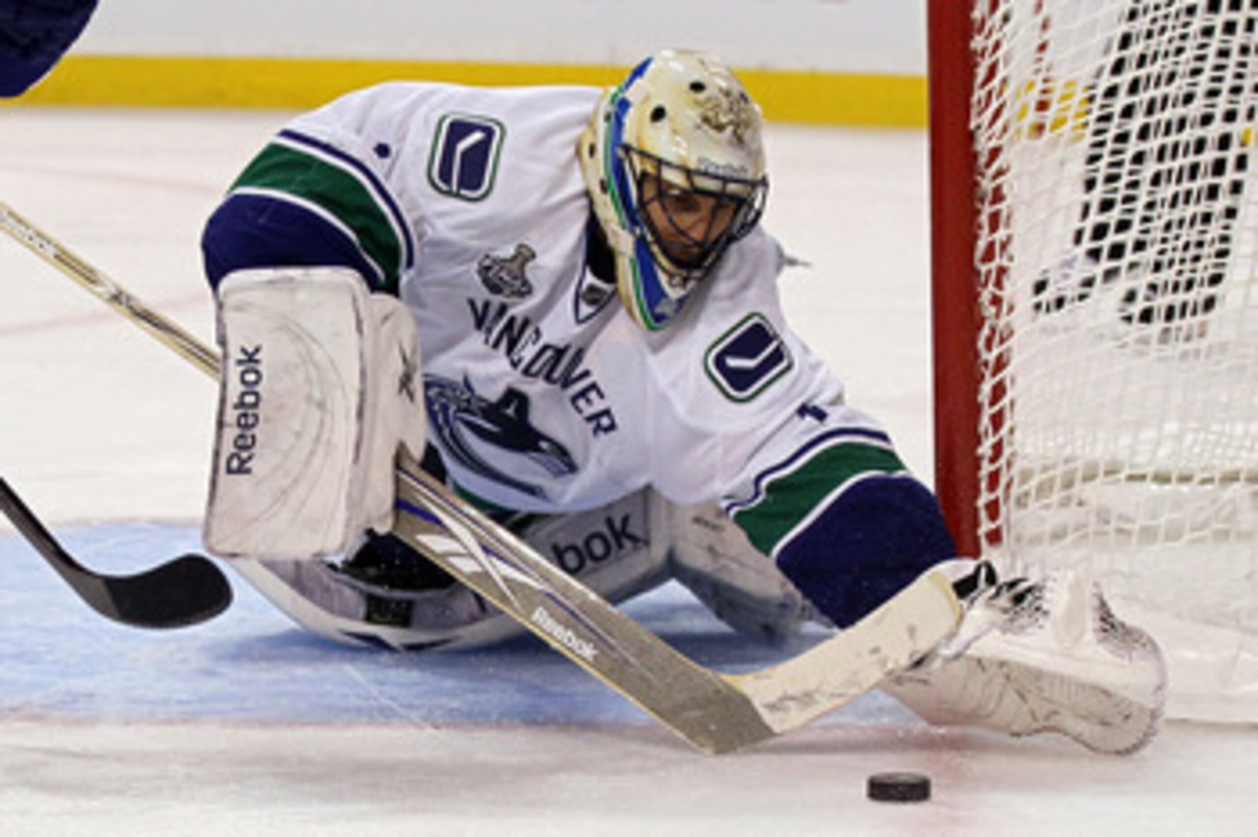 BOSTON, MA - JUNE 13:  Roberto Luongo #1 of the Vancouver Canucks tend goal against the Boston Bruins during Game Six of the 2011 NHL Stanley Cup Final at TD Garden on June 13, 2011 in Boston, Massachusetts.  (Photo by Elsa/Getty Images)