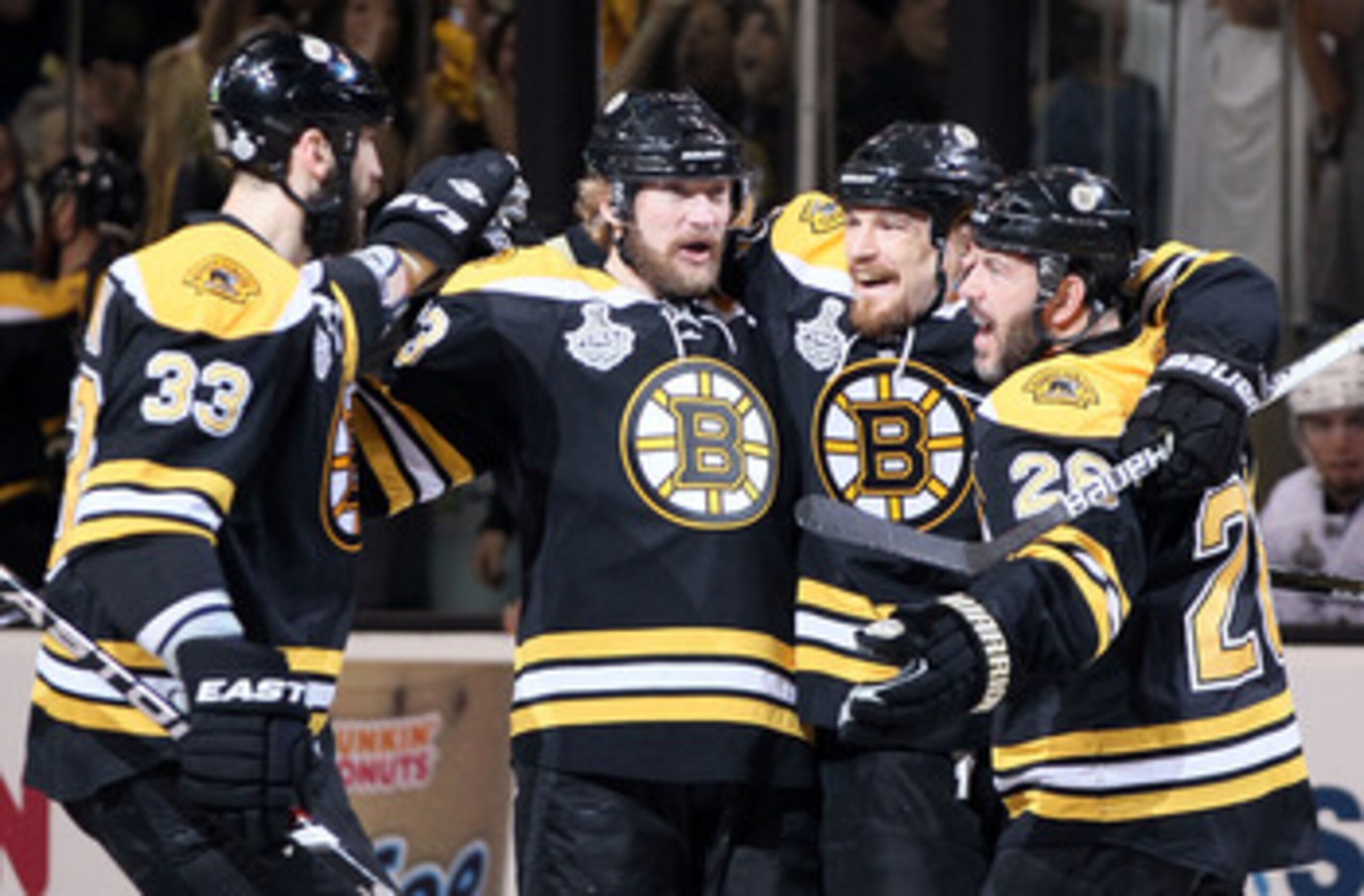 BOSTON, MA - JUNE 13:  Michael Ryder #73, Andrew Ference #21, Zdeno Chara #33, and Mark Recchi #28 of the Boston Bruins celebrate after the 3rd goal scored in the first period against the Vancouver Canucks during Game Six of the 2011 NHL Stanley Cup Final