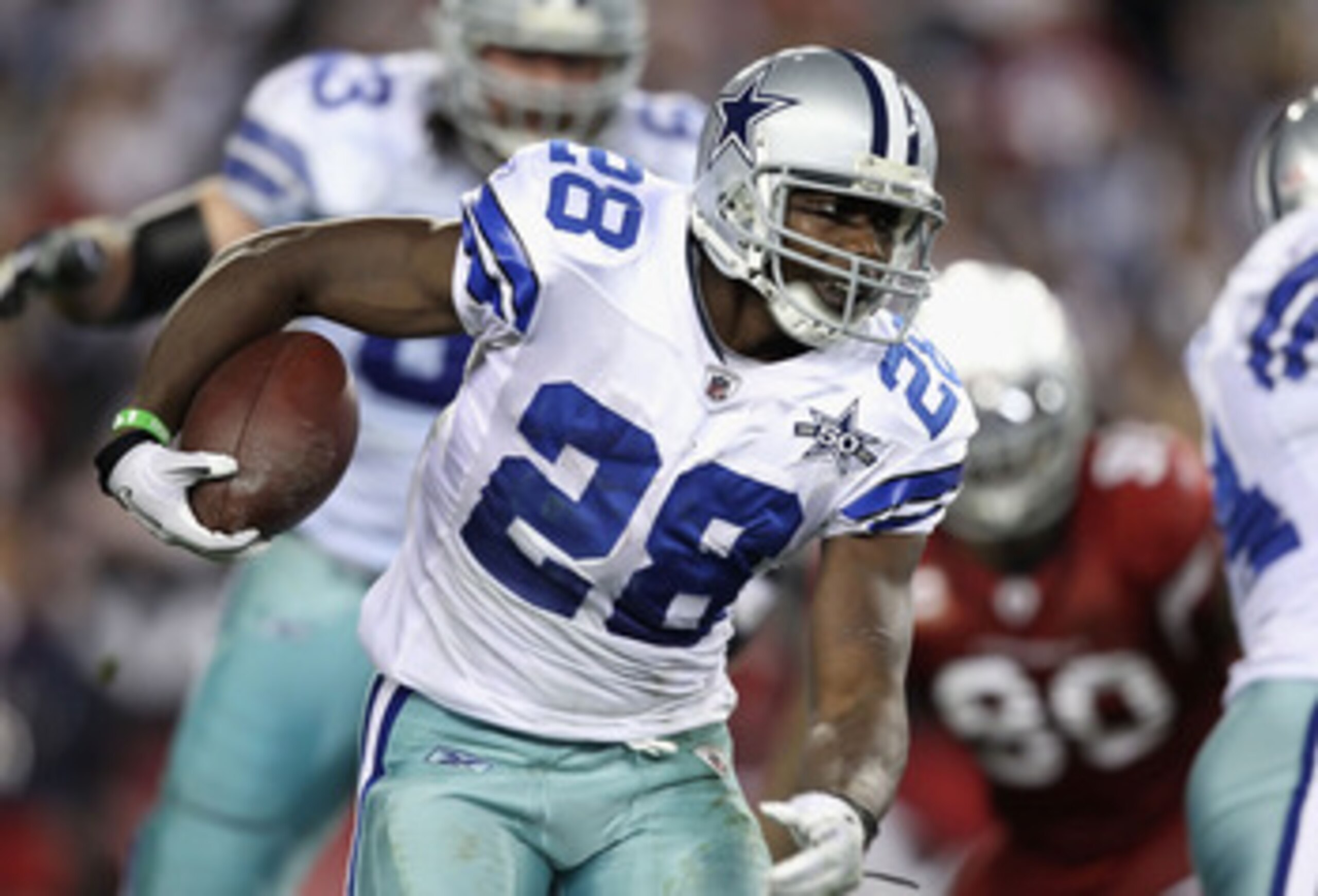 GLENDALE, AZ - DECEMBER 25:  Runningback Felix Jones #28 of the Dallas Cowboys rushes the football during the NFL game against the Arizona Cardinals at the University of Phoenix Stadium on December 25, 2010 in Glendale, Arizona.  The Cardinals defeated th