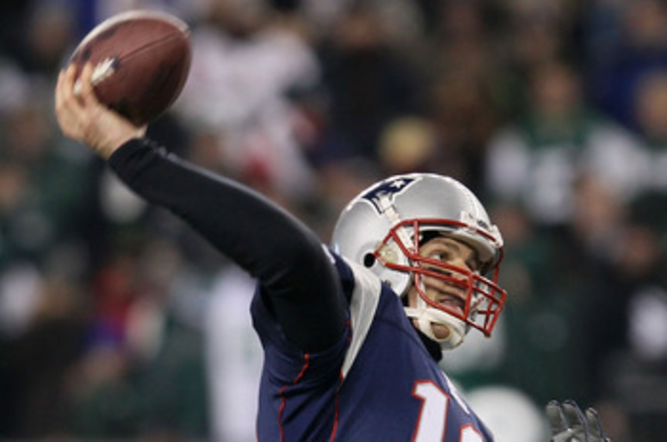 FOXBORO, MA - JANUARY 16:  Quarterback Tom Brady #12 of the New England Patriots throws a pass during their 2011 AFC divisional playoff game against the New York Jets at Gillette Stadium on January 16, 2011 in Foxboro, Massachusetts.  (Photo by Elsa/Getty