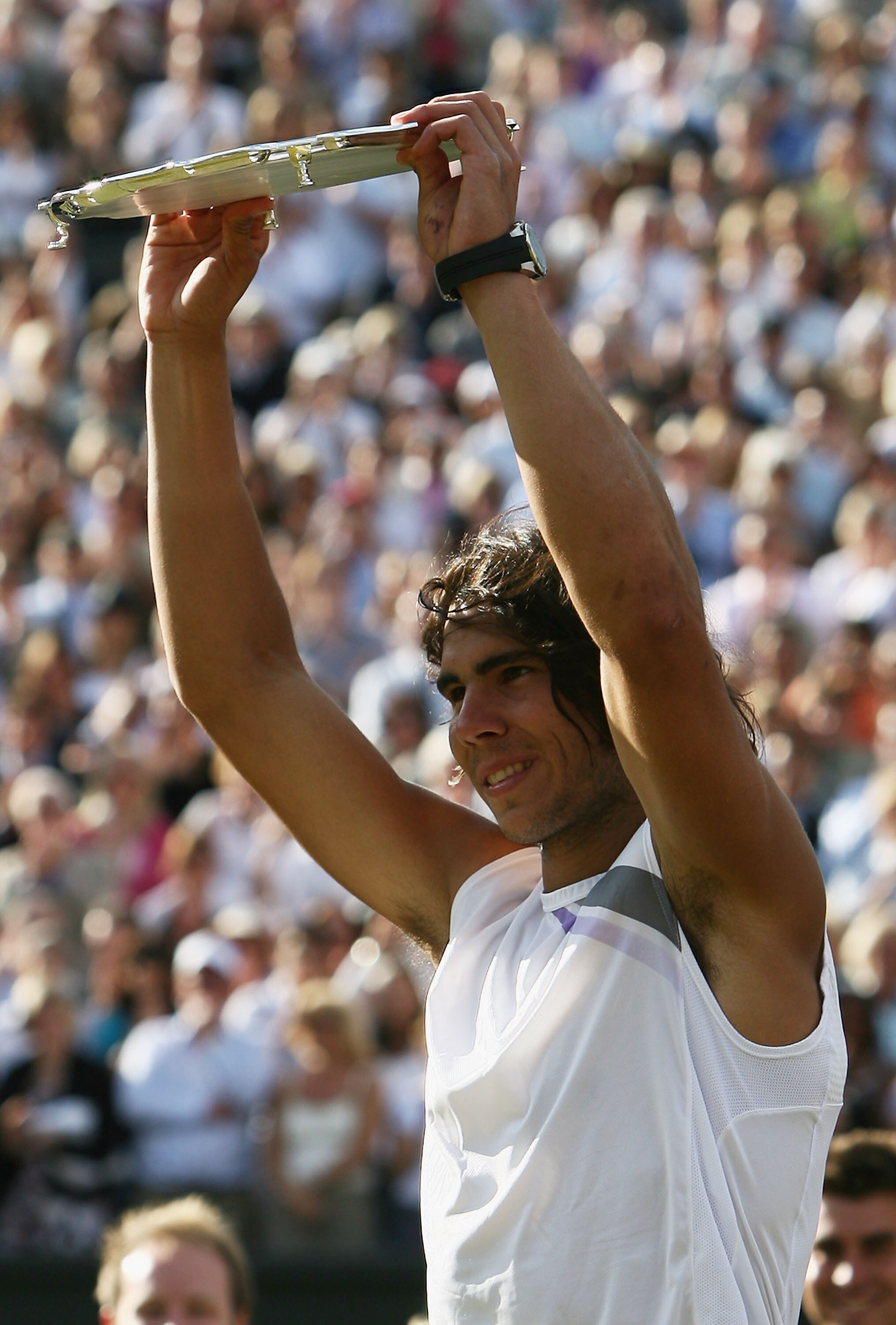 LONDON - JULY 08:  Runner-up Rafael Nadal of Spain salutes the crowd following the Men's Singles final match against Roger Federer of Switzerland during day thirteen of the Wimbledon Lawn Tennis Championships at the All England Lawn Tennis and Croquet Clu