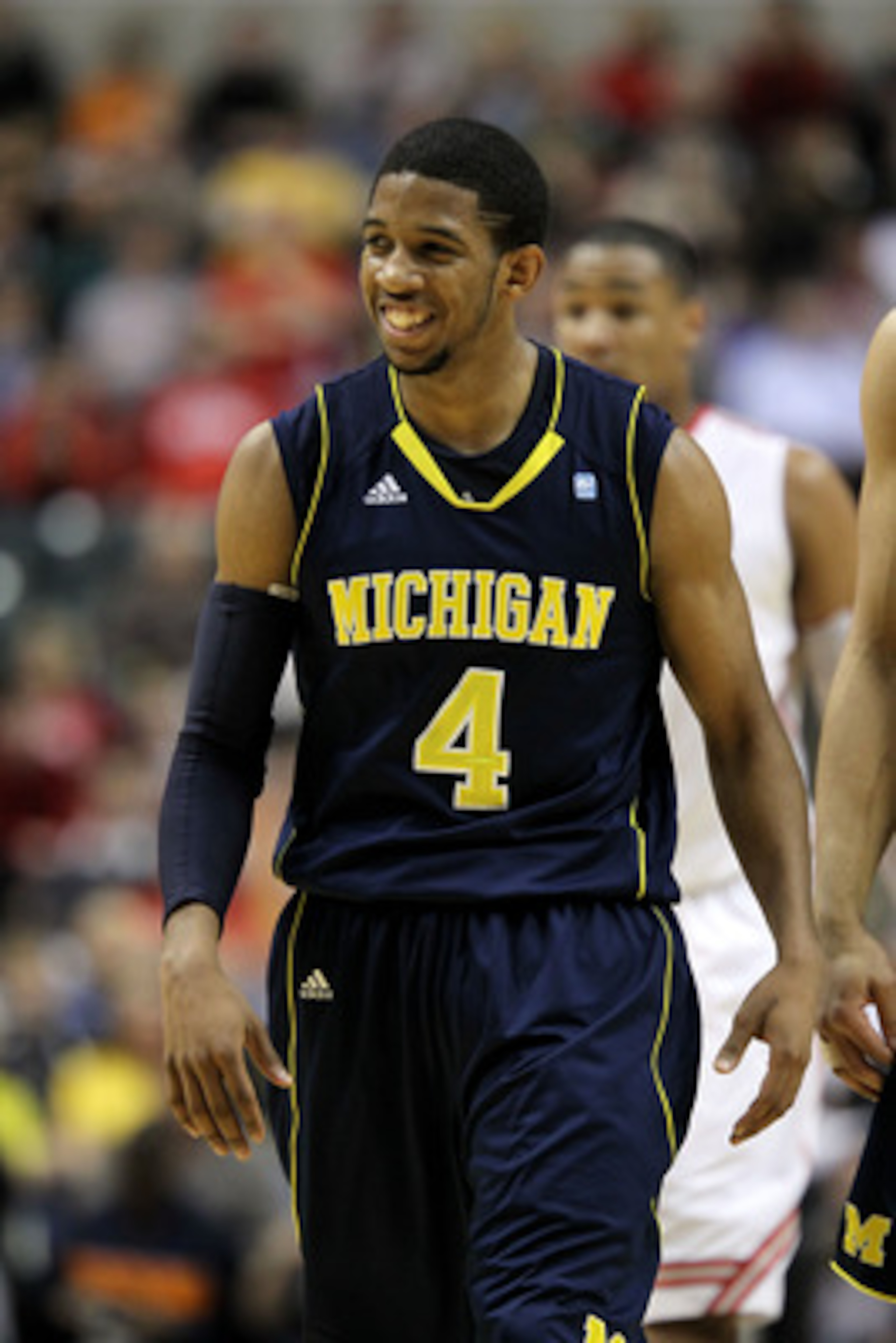 INDIANAPOLIS, IN - MARCH 12: Darius Morris #4 of the Michigan Wolverines smiles as he looks on against the Ohio State Buckeyes during the semifinals of the 2011 Big Ten Men's Basketball Tournament at Conseco Fieldhouse on March 12, 2011 in Indianapolis, INDIANAPOLIS, IN - MARCH 12: Darius Morris #4 of the Michigan Wolverines smiles as he looks on against the Ohio State Buckeyes during the semifinals of the 2011 Big Ten Men's Basketball Tournament at Conseco Fieldhouse on March 12, 2011 in Indianapolis,